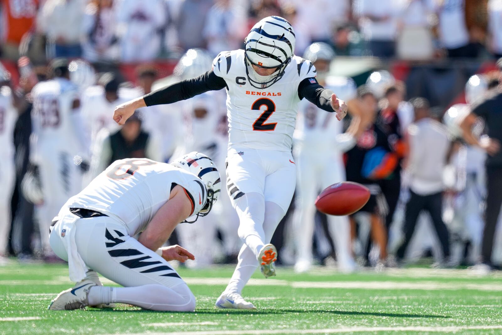 Cincinnati Bengals kicker Evan McPherson (2), with Ryan Rehkow holding, kicks a field goal against the Philadelphia Eagles during the first half of an NFL football game, Sunday, Oct. 27, 2024 in Cincinnati. (AP Photo/Carolyn Kaster)