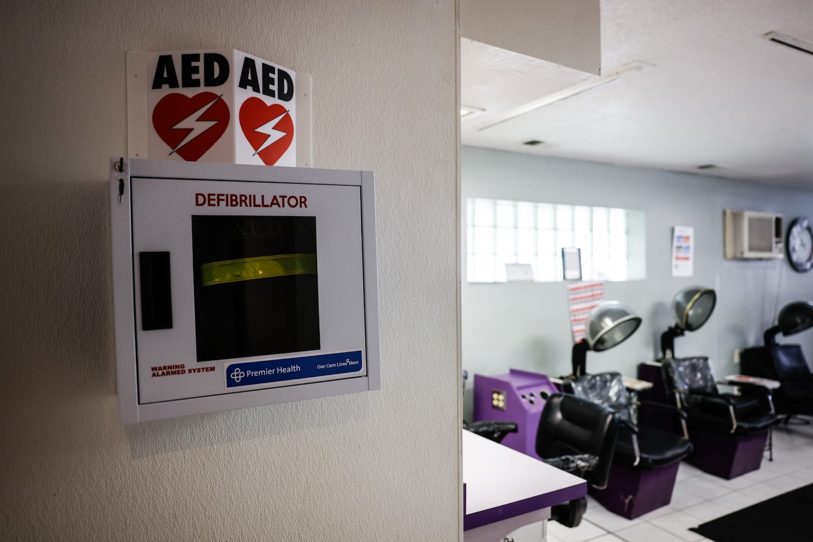 Premier Health's Barbershop Health Program is providing five defibrillators at barbershops around Dayton. JIM NOELKER/STAFF