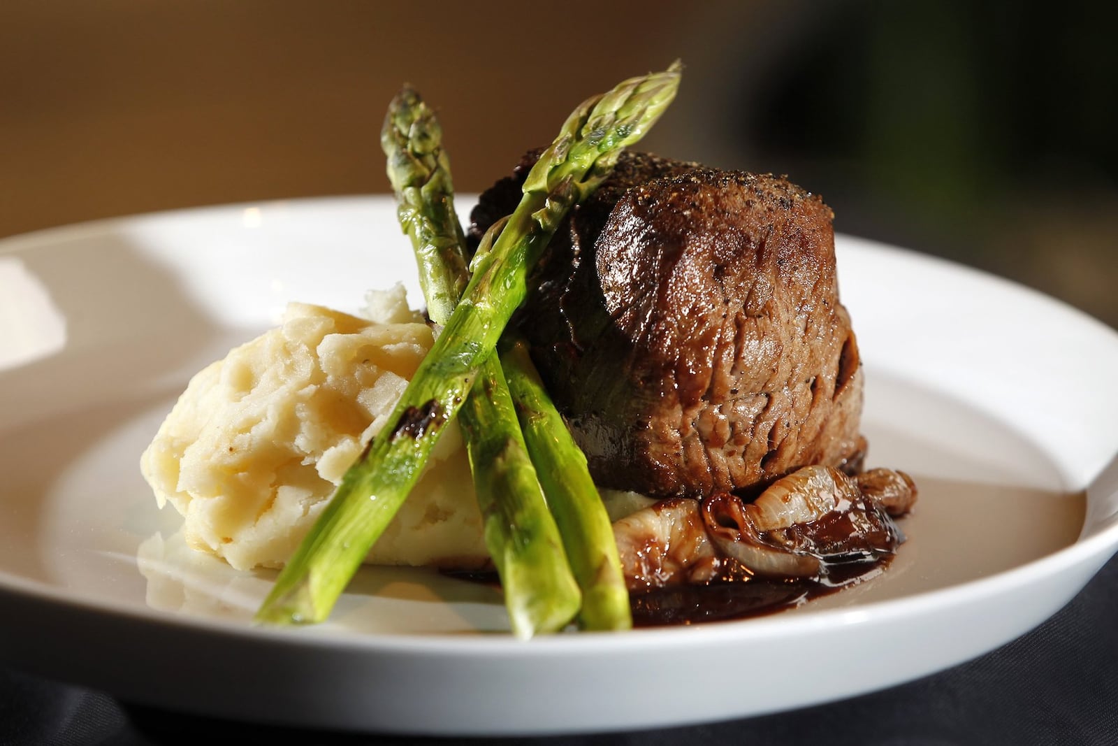 Filet mignon with cipollini onions, bordelaise, grilled asparagus and mashed potatoes from the regular menu at Roost Modern Italian in the Oregon District. The restaurant was founded by chef Dana Downs who takes traditional Italian foods and uses modern techniques and ingredients to develop unique flavors. The dinner-only restaurant is located at 524 E. Fifth St. in Dayton and will be a participant in Winter Restaurant Week. LISA POWELL / STAFF