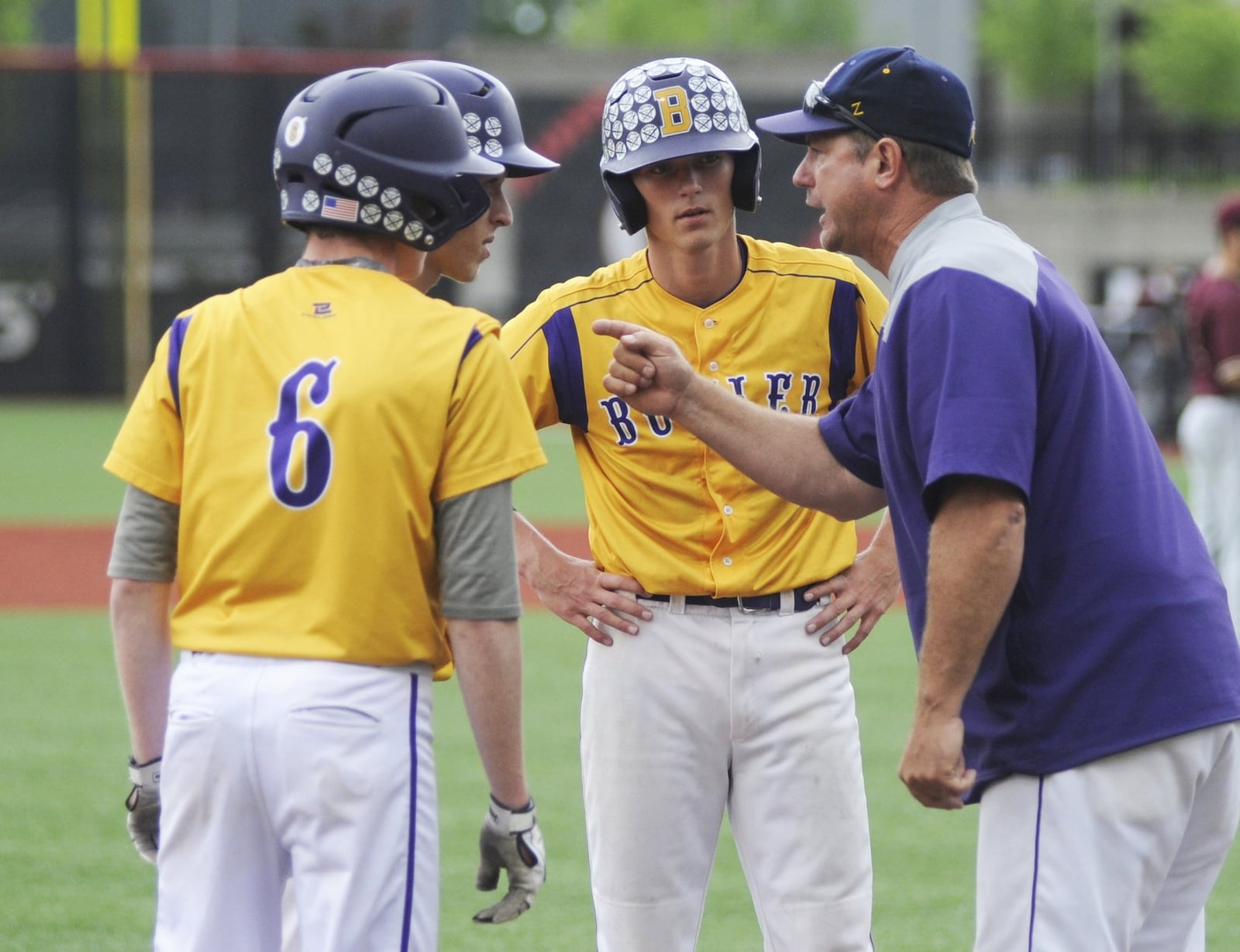 Butler coach Trent Dues huddles with the Aviators. Butler lost 4-2 to Cincinnati Turpin in a Division I high school baseball regional semifinal at the University of Cincinnati’s Marge Schott Stadium on Thursday, May 30, 2019. MARC PENDLETON / STAFF