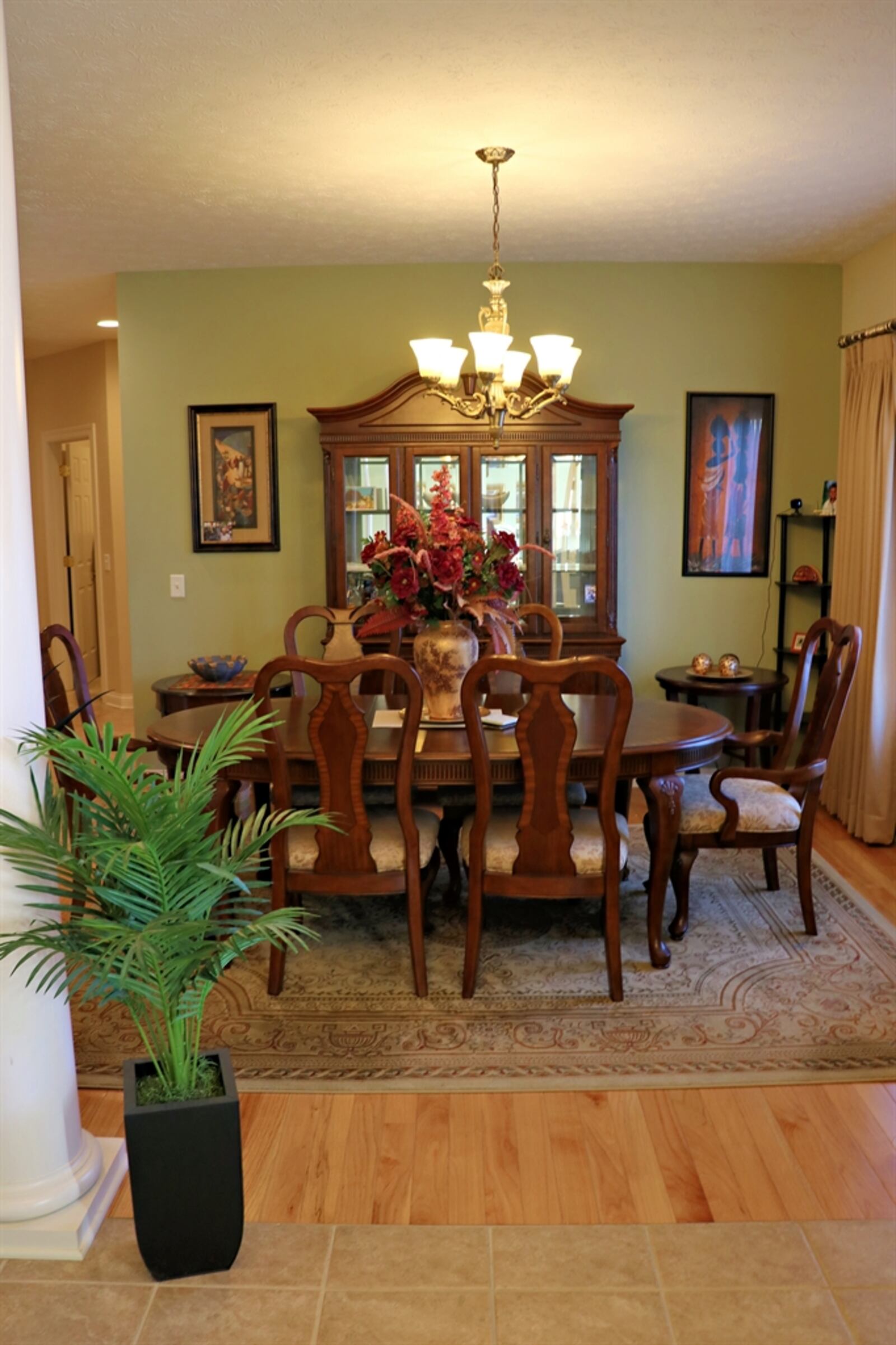 The formal dining room features hardwood flooring. 