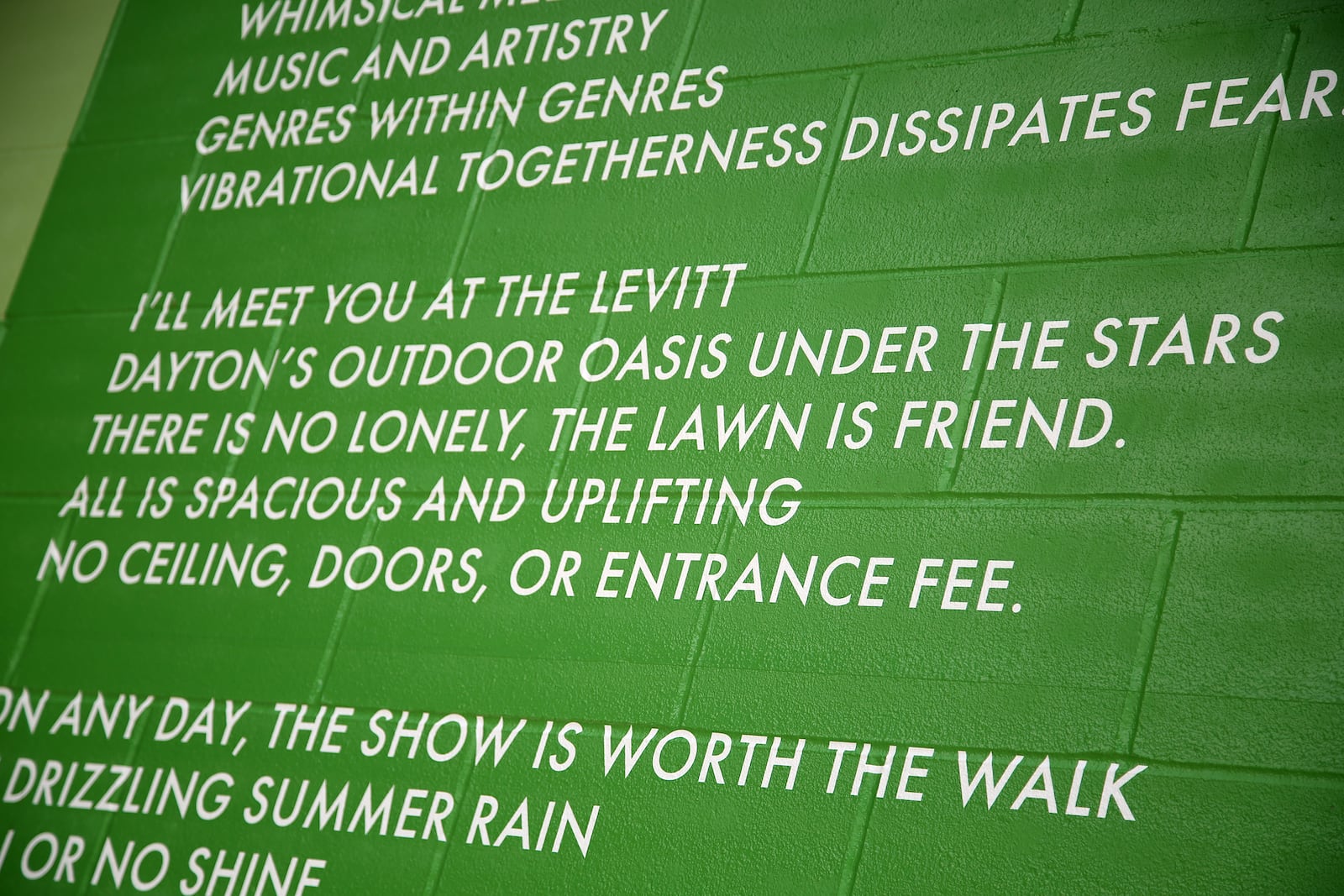 MixedA new mural, with poetry written by Sierra Leone,  has been completed at the Levitt Pavilion in Dayton. The poem, “Music Heals on Fifth and Main,” can be read in full on the north side of the building located east of the pavilion. The mural, a combination of bold shapes and bright colors, was designed by Brent Beck and executed by Atalie Gagnet, two local artists.   LISA POWELL / STAFF