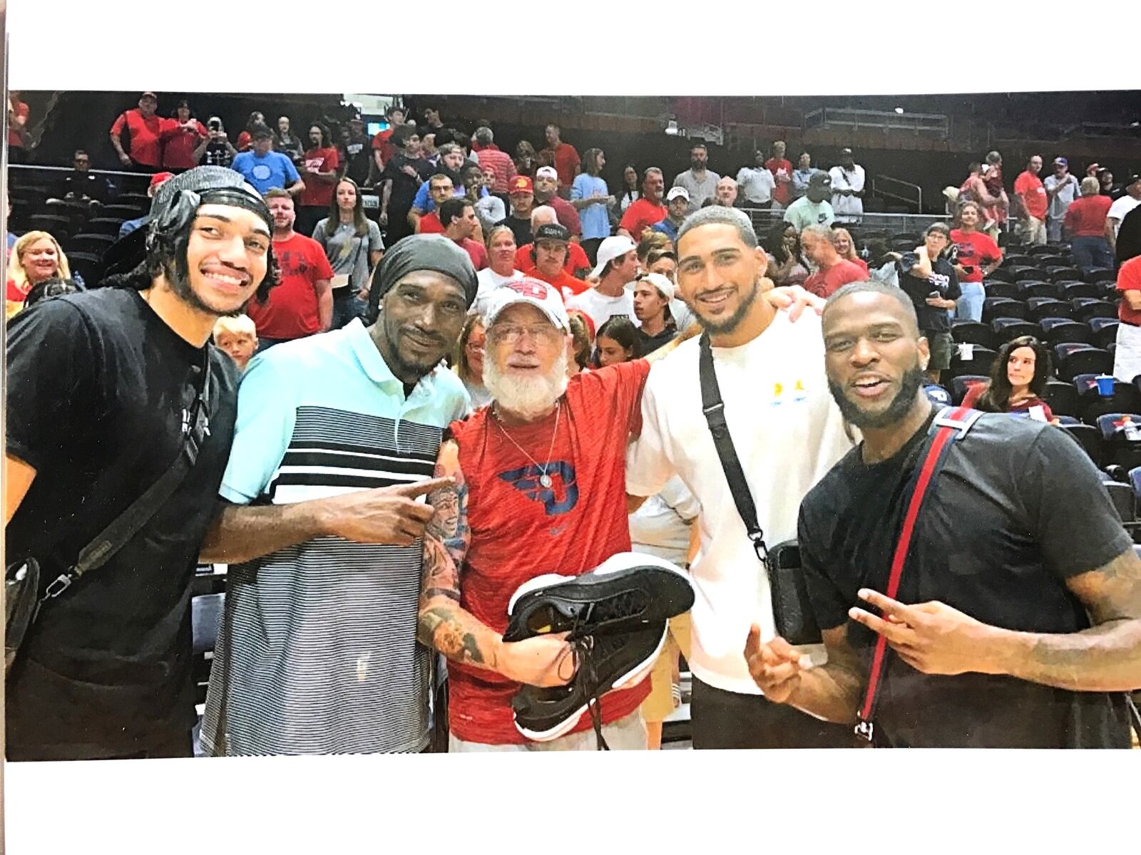 Mark Haufe, holding a pair of basketball shoes Obi Toppin gave him, is flanked (left to right) by Jacob Toppin, Obi’s brother who now plays for the Atlanta Hawks; Obadiah Toppin Sr., who was a hoops legend on the streets of New York City; Obi Toppin now with the Indiana Pacers and Jalen Crutcher who’s now with the New Orleans Pelicans. CONTRIBUTED