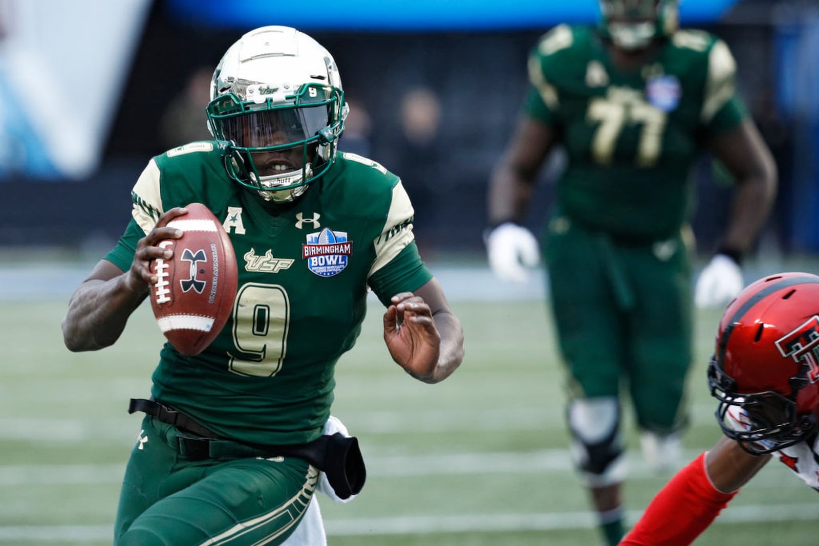 BIRMINGHAM, AL - DECEMBER 23: Quinton Flowers #9 of the South Florida Bulls runs for a 29-yard gain to set up the game winning score against the Texas Tech Red Raiders during the Birmingham Bowl at Legion Field on December 23, 2017 in Birmingham, Alabama. South Florida won 38-34. (Photo by Joe Robbins/Getty Images)