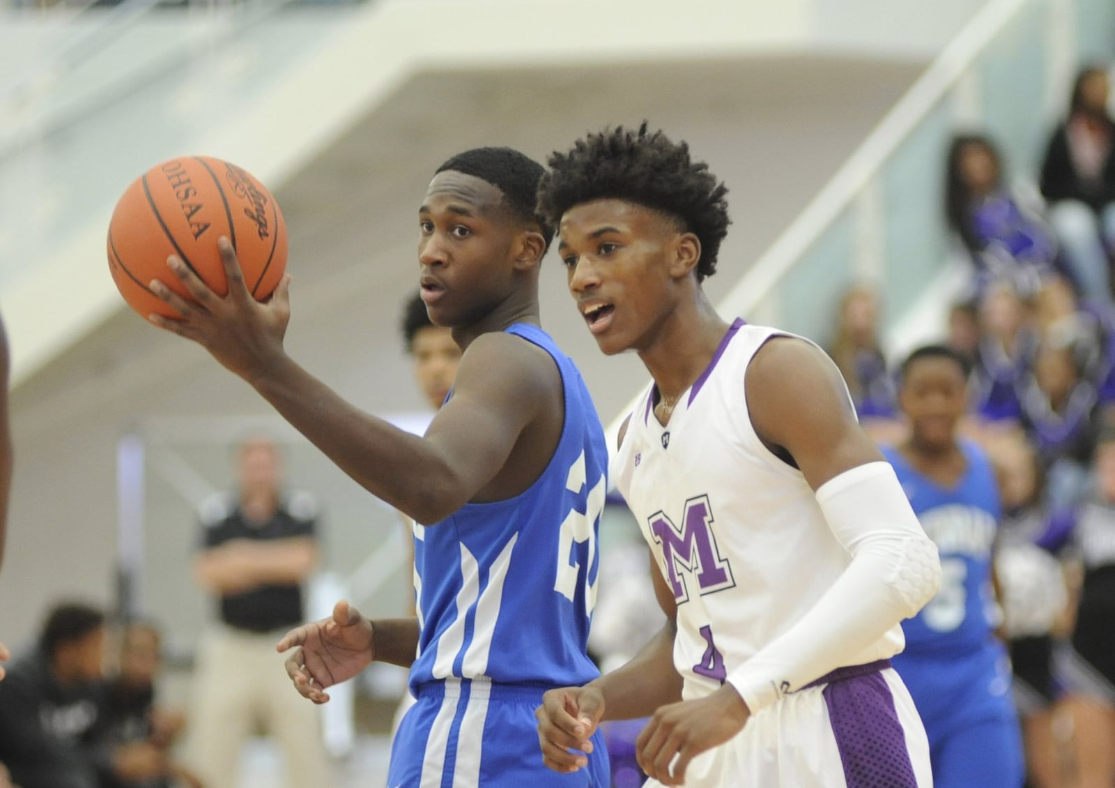 Dunbar’s Marcellis Thompson (left) and Aaron Jones of Middletown look for the call. Middletown defeated visiting Dunbar 60-28 in a boys high school basketball game on Tuesday, Dec. 4, 2018. MARC PENDLETON / STAFF