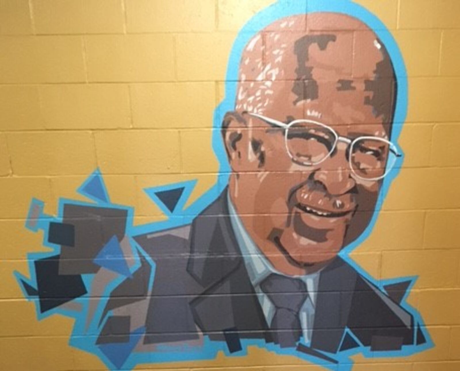 This mural of John E. Moore, by Xenia artist Maggie Reckers, is painted on a wall at Mckinley United Methodist Church (Photo taken by Ray Marcano)