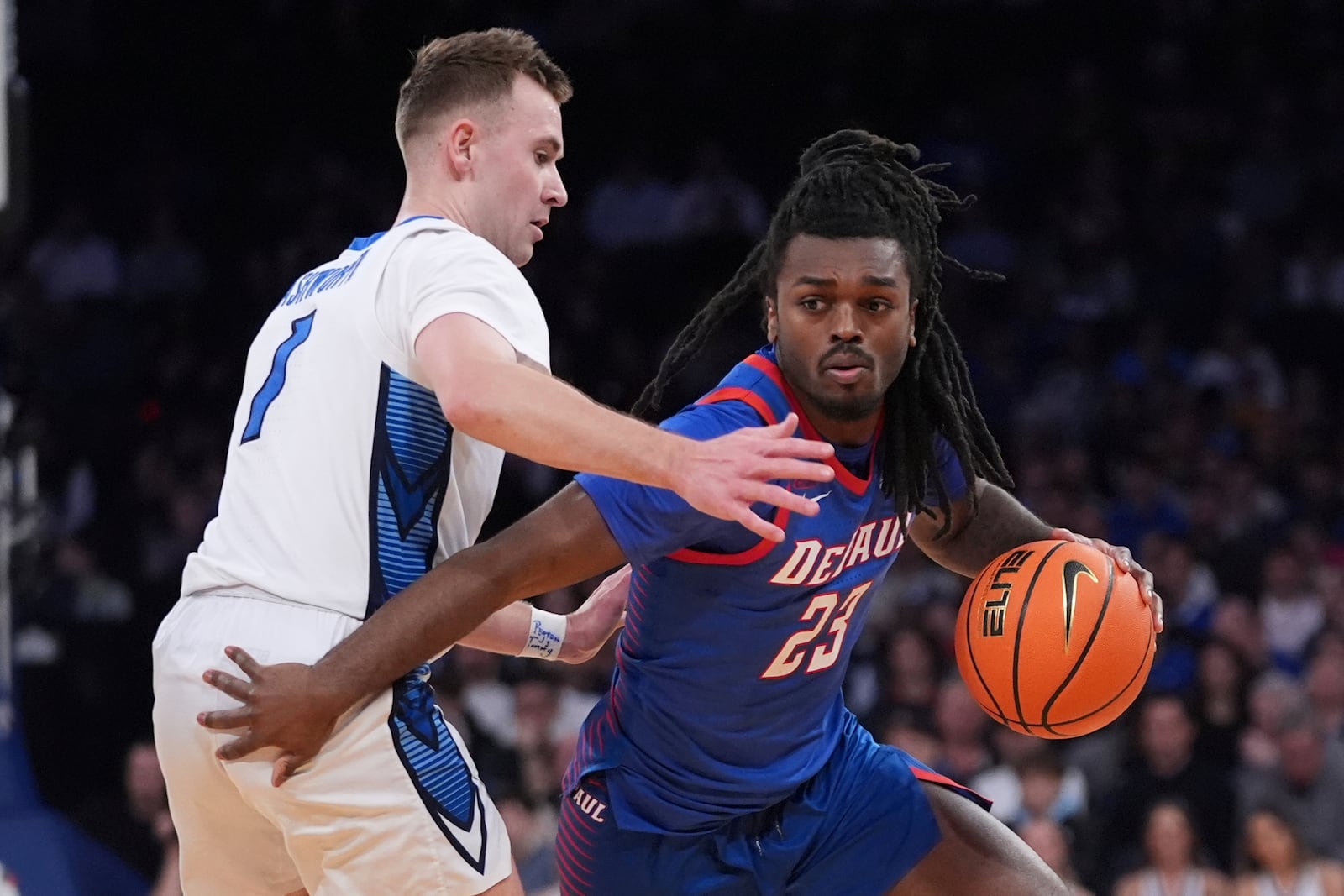 Creighton's Steven Ashworth (1) defends DePaul's David Thomas (23) during the second half of an NCAA college basketball game at the Big East basketball tournament Thursday, March 13, 2025, in New York. (AP Photo/Frank Franklin II)