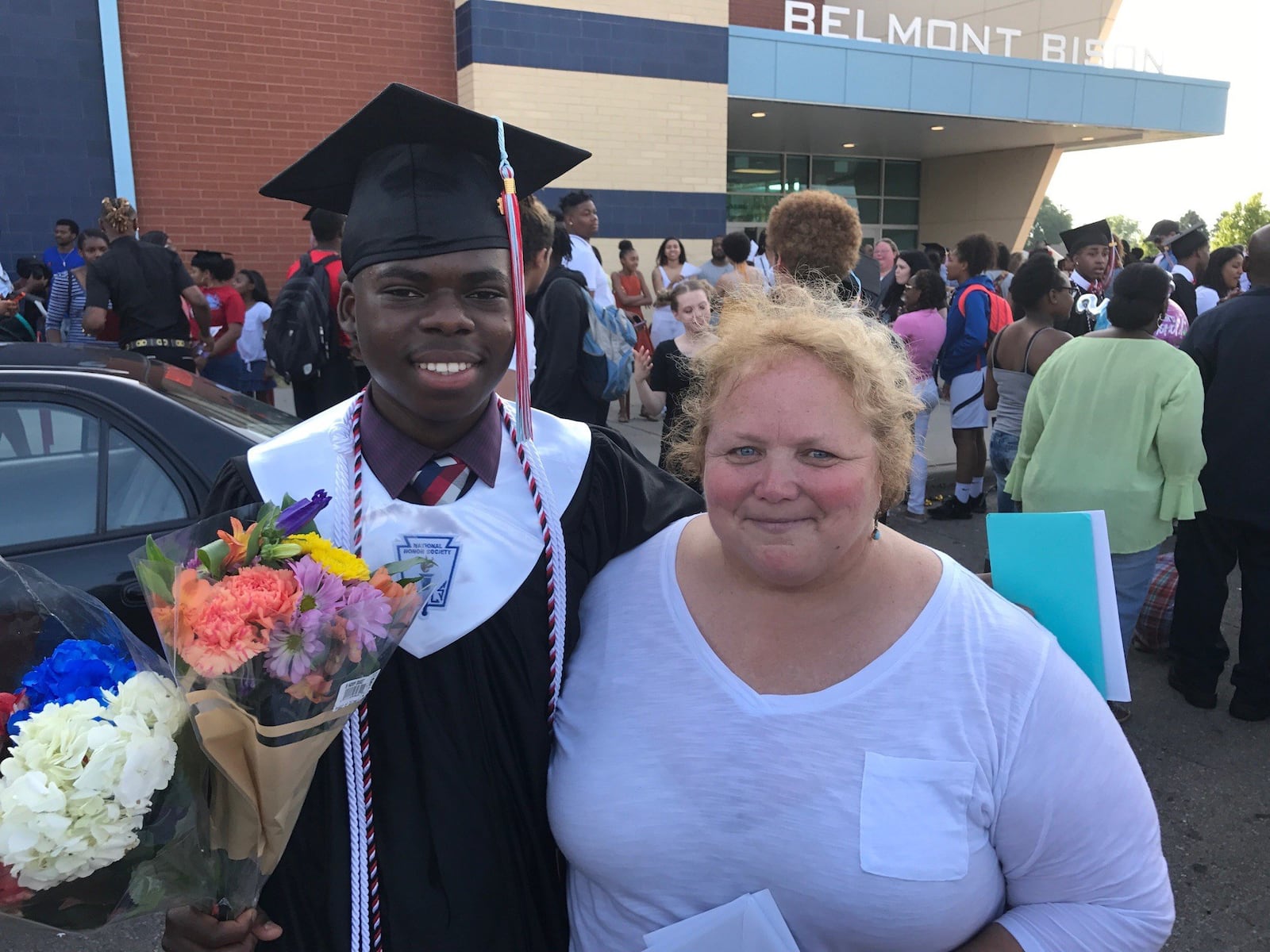 Bibebibyo Seko with former Belmont coach Julie Raiff, the coach who championed the team of immigrants to the city and is a big reason some are getting scholarships now. TOM ARCHDEACON / STAFF