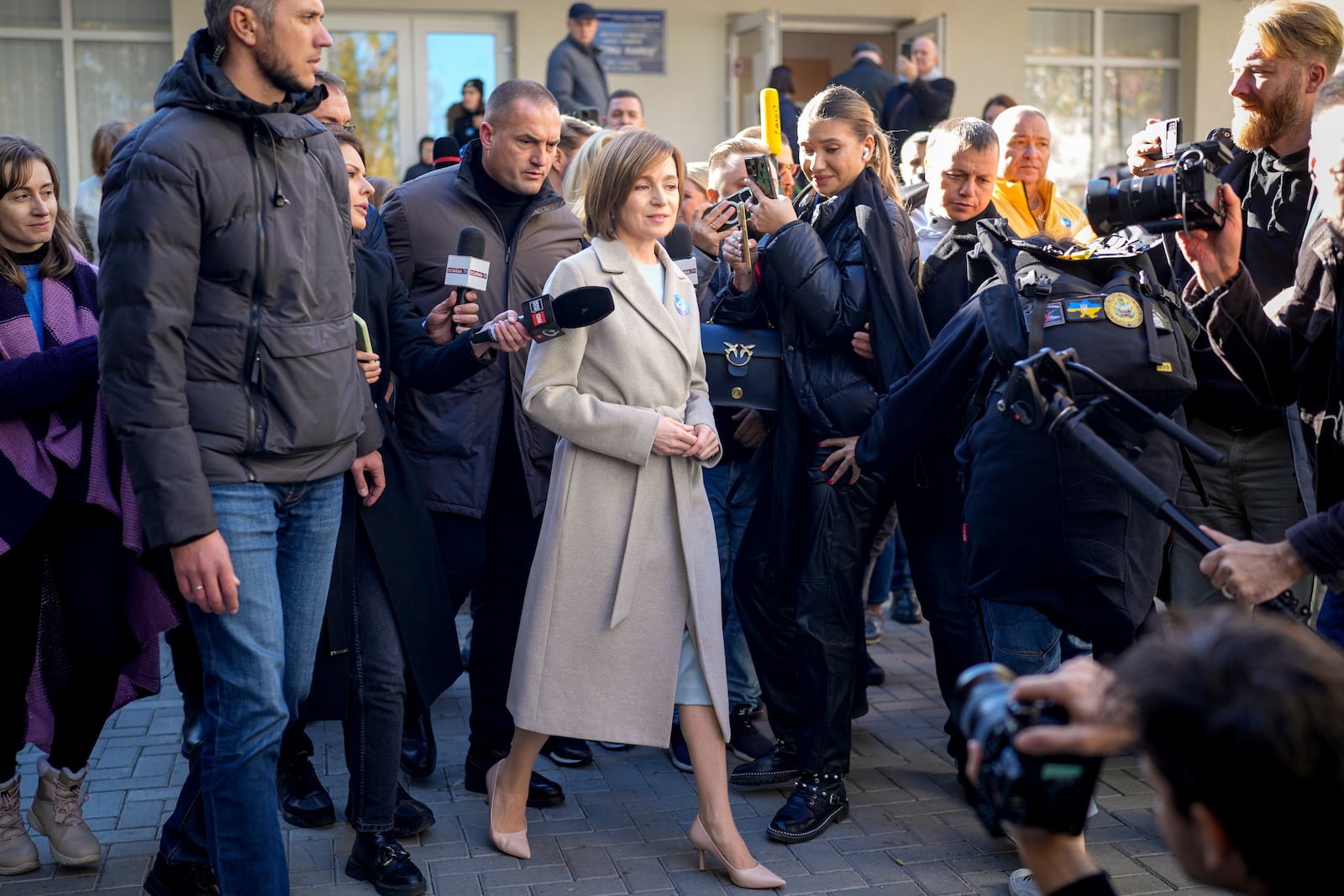 Moldova's President Maia Sandu speaks to the media after casting her vote during a presidential election runoff, in Chisinau, Moldova, Sunday, Nov. 3, 2024. (AP Photo/Vadim Ghirda)