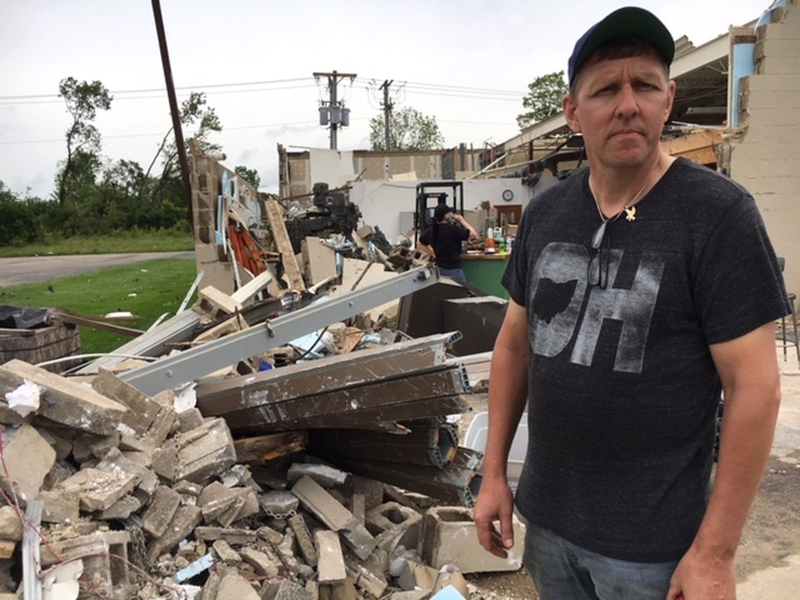 Curt Morgan, owner of Morgan Tool & Machine LLC, was unsure about his next step Wednesday after surveying the destruction of his shop at 3500 Stop Eight Road. “It’s hard to know what to do. You’re stuck,” he said. THOMAS GNAU/STAFF