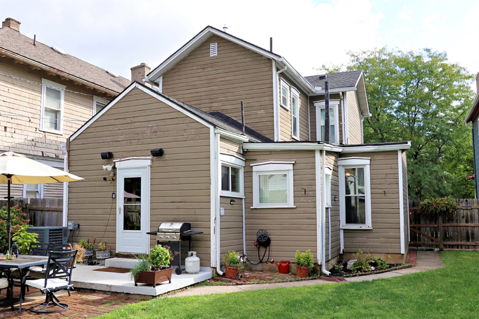 The property includes a deep back yard surrounded by a wooden privacy fence. CONTRIBUTED PHOTO BY KATHY TYLER