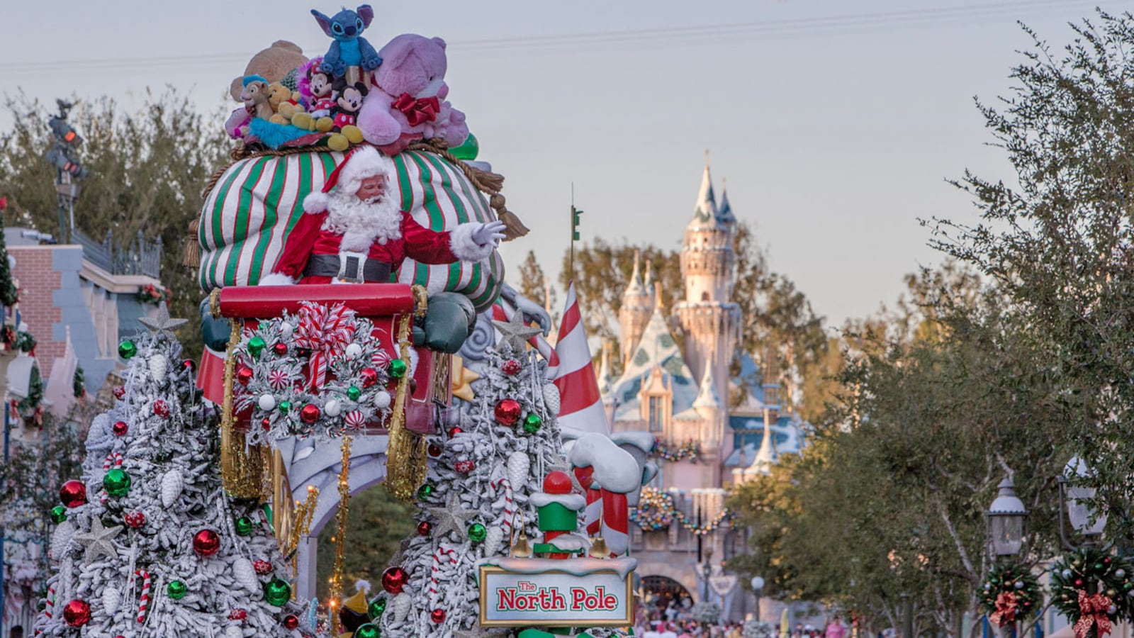 Santa Claus waves to Disneyland guests from his sleigh during the seasonal A Christmas Fantasy parade, performed daily at Disneyland Park. The joyful procession features a flurry of characters, music, and floats, bringing seasonal magic to the Happiest Place on Earth. Disneyland Resort is located in Anaheim, Calif.