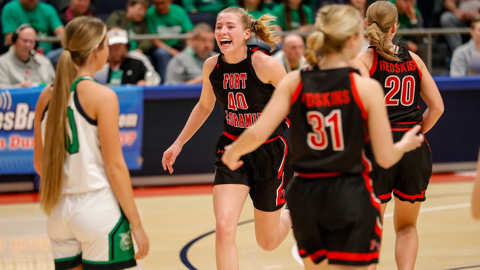 Fort Loramie High School junior Avery Brandewie celebrates as she is subbed off the floor during the Division IV state championship game against Waterford on Saturday, March 16 at University of Dayton Arena. The Redskins beat the Wildcats 42-29 to win their second state championship in four seasons. Michael Cooper/CONTRIBUTED