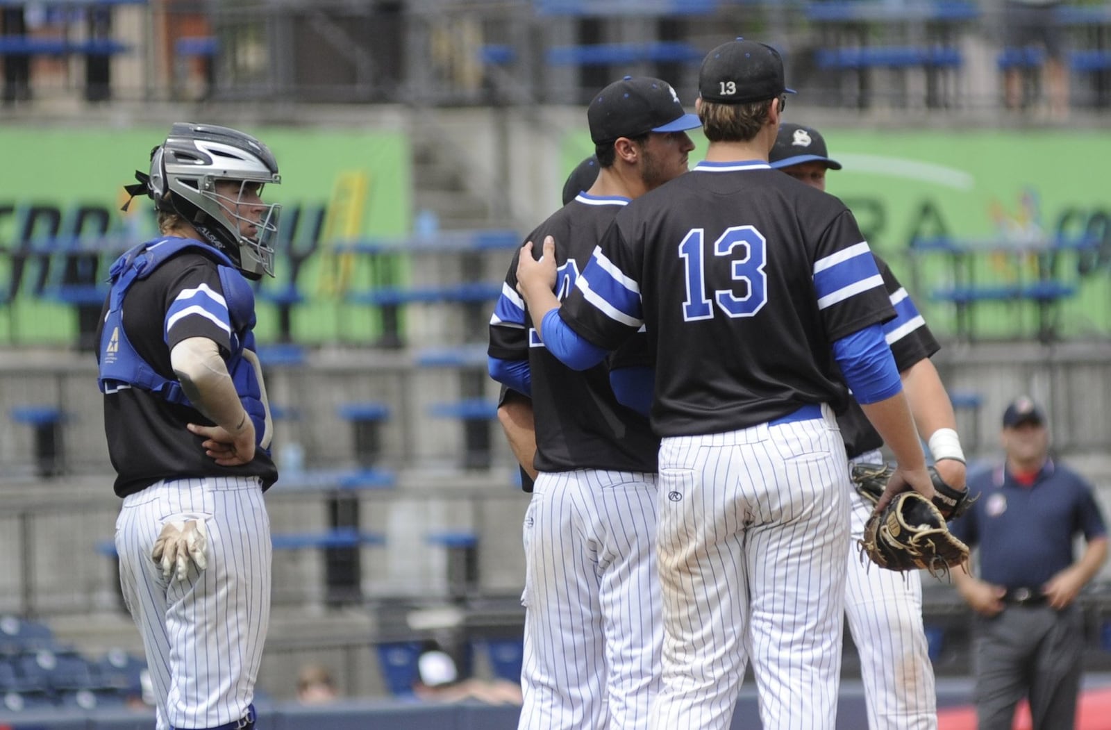 Springboro starting pitcher Tyler Kean (middle) lasted 4.2 innings. At left is catcher Jake D’Amico and first baseman Logan Zier (13). Mentor defeated Springboro 4-0 in a D-I baseball state semifinal at Akron’s Canal Park on Friday, June 7, 2019. MARC PENDLETON / STAFF