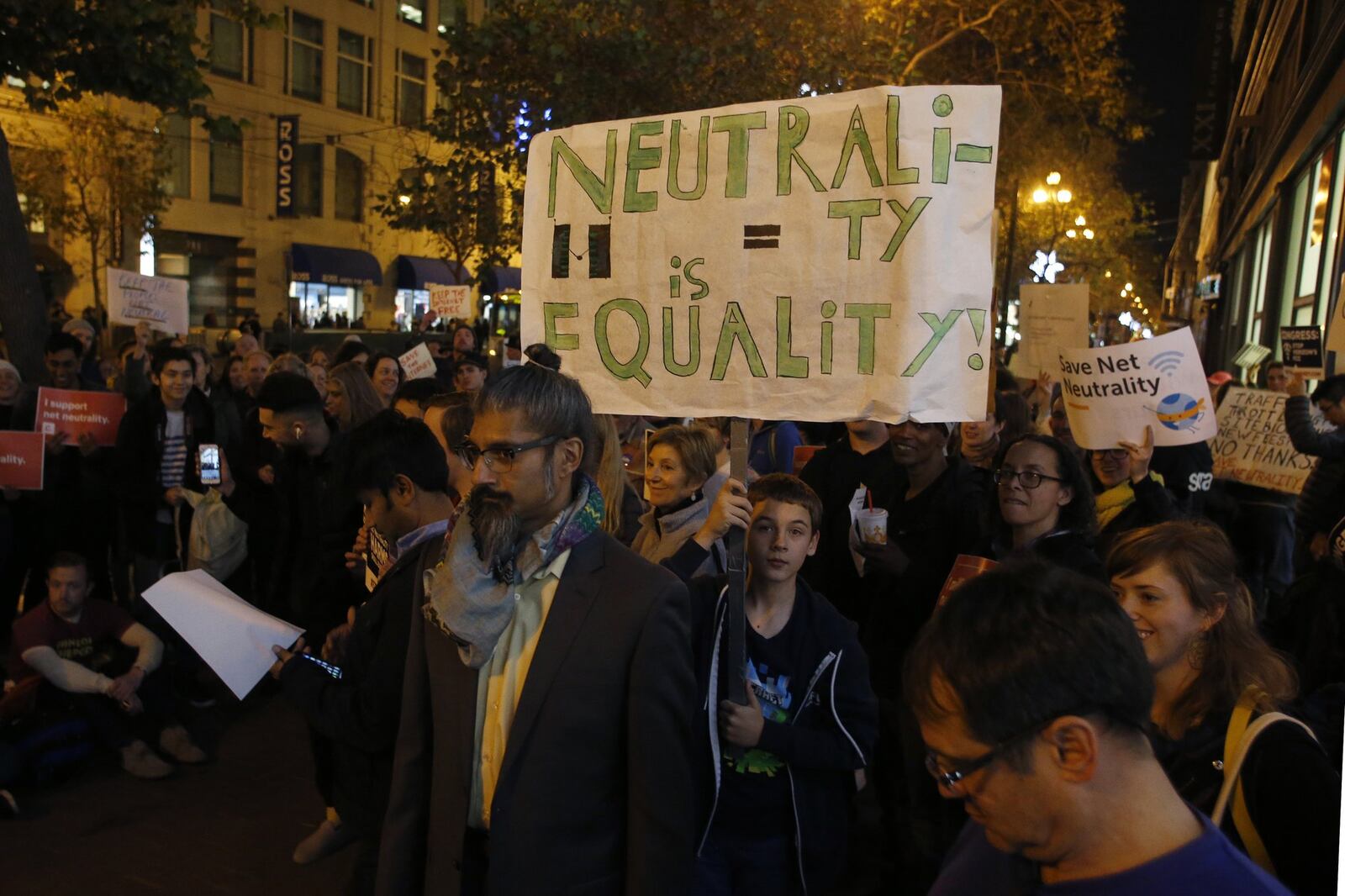 Protesters fighting to save net neutrality rally outside the Verizon store on Market Street in San Francisco, Calif., Thursday, Dec. 7, 2017. Verizon stores across the country were sites for coordinated protests one week before the FCC votes on the net neutrality issue. (Karl Mondon/Bay Area News Group/TNS)