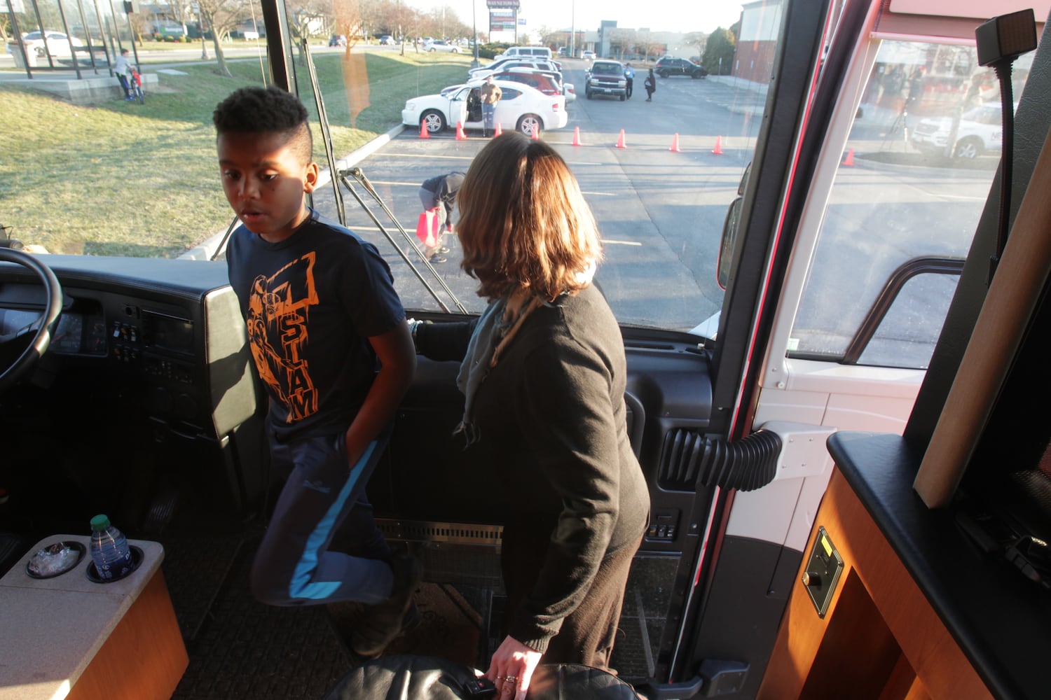 College basketball fans get an early view  of the ESPN College GameDay bus in Huber Heights at the Krogers on Old Troy Pike Thursday.