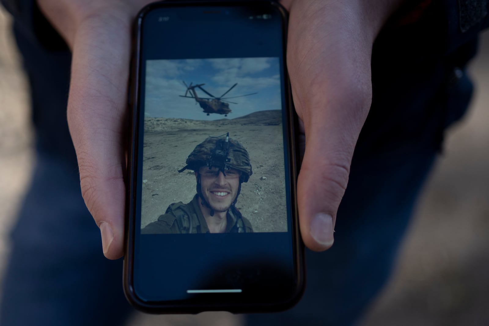 Max Kresch, a medic army reservist who has joined a growing number of Israeli soldiers speaking out against the 15-month conflict in the Gaza Strip and refusing to continue fighting, shows an undated photo of himself during his mandatory army service, in Jerusalem, on Thursday, Jan. 9, 2025. (AP Photo/Maya Alleruzzo)