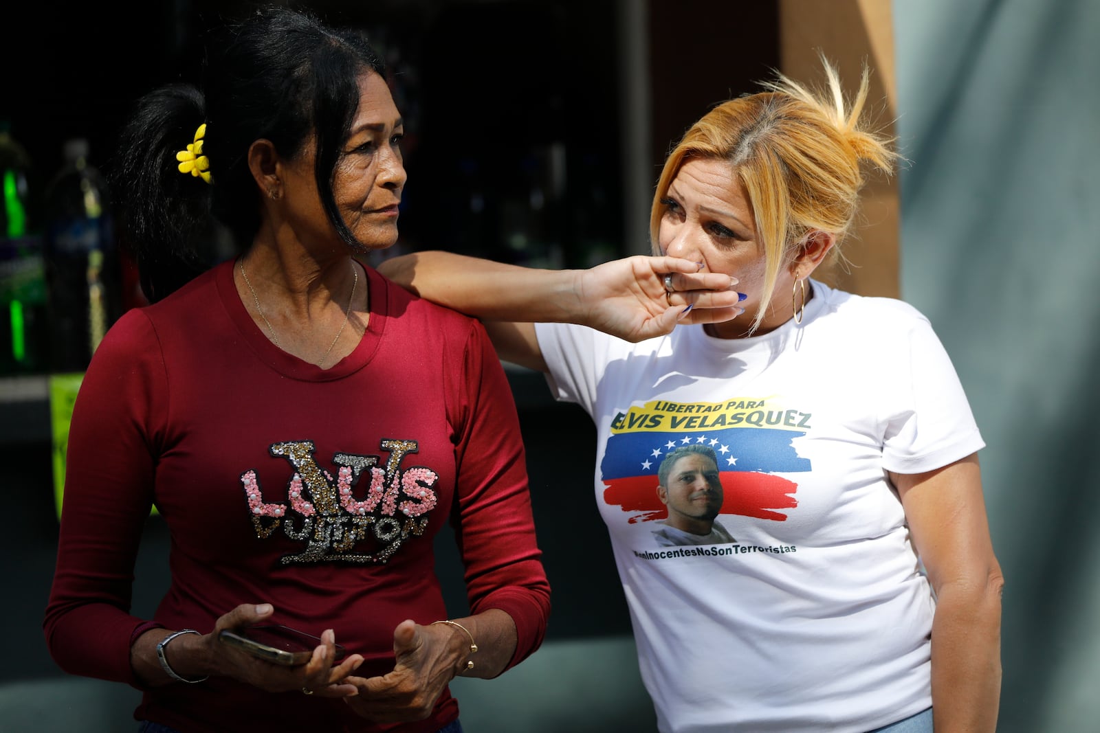 Julia Azocar, right, relative of Luis Velasquez, waits for his release outside the Yare 3 prison in San Francisco de Yare, Venezuela, Saturday, Nov 16, 2024. Attorney General Tarek William Saab announced the release of some of those who were detained during a government crackdown following anti-government protests against the results of the presidential election. (AP Photo/Cristian Hernandez)