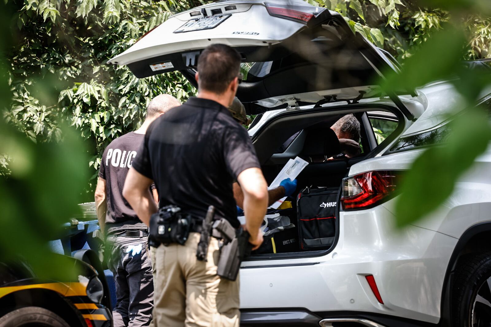 Homeland Security Investigations and Dayton police were outside a residence in the 1100 block of Irving Avenue as part of a federal investigation into allegations of financial crimes and labor exploitation. Search warrants were served at Fuyao Glass America and 27 other locations in the region on Friday, July 26, 2024, as part of the investigation. JIM NOELKER / STAFF