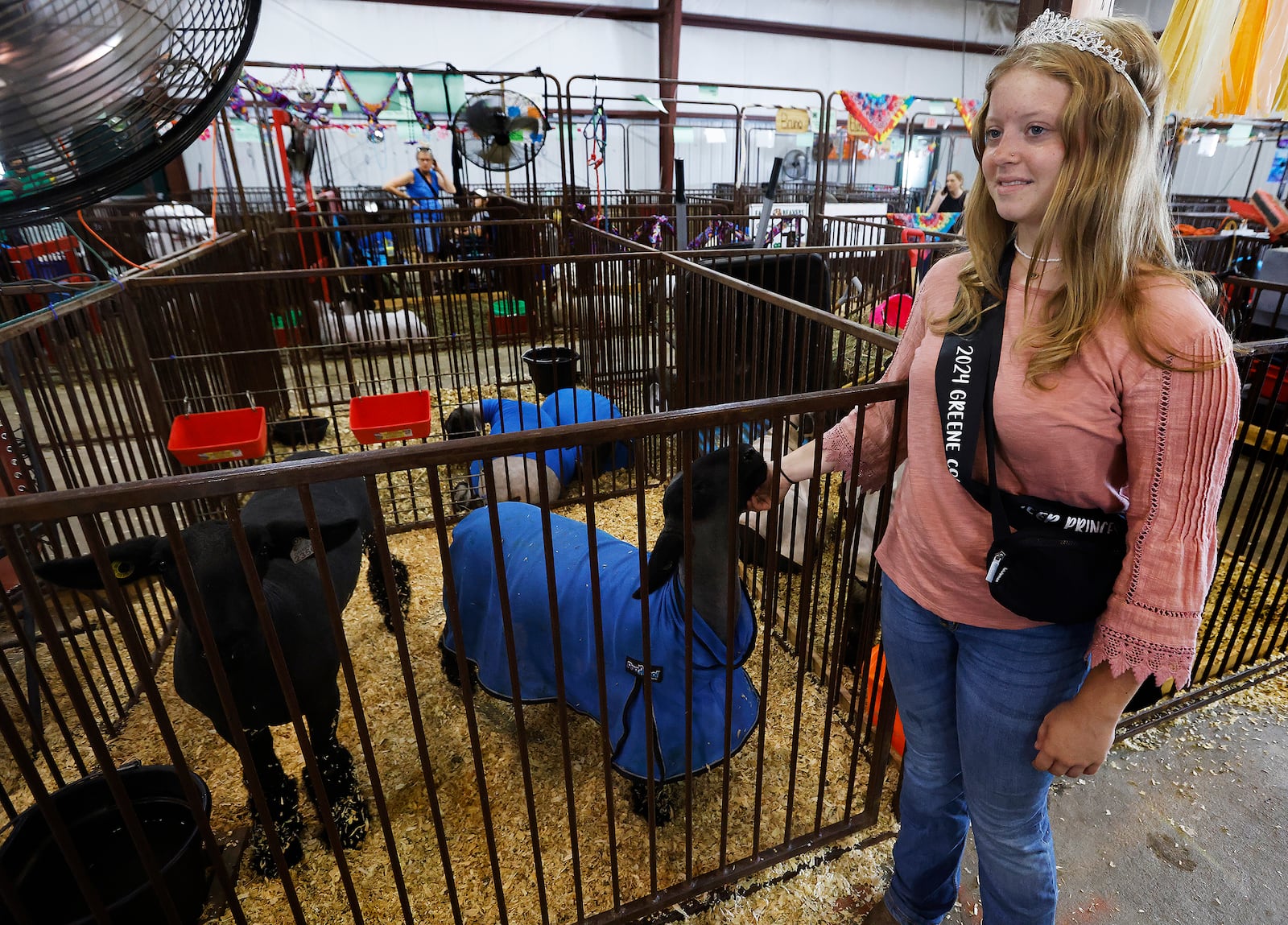 Greene County Fair Sheep Princess, Breanna Coates, talks Tuesday, July 30, 2024 about what she likes about showing her sheep at the fair. MARSHALL GORBY\STAFF