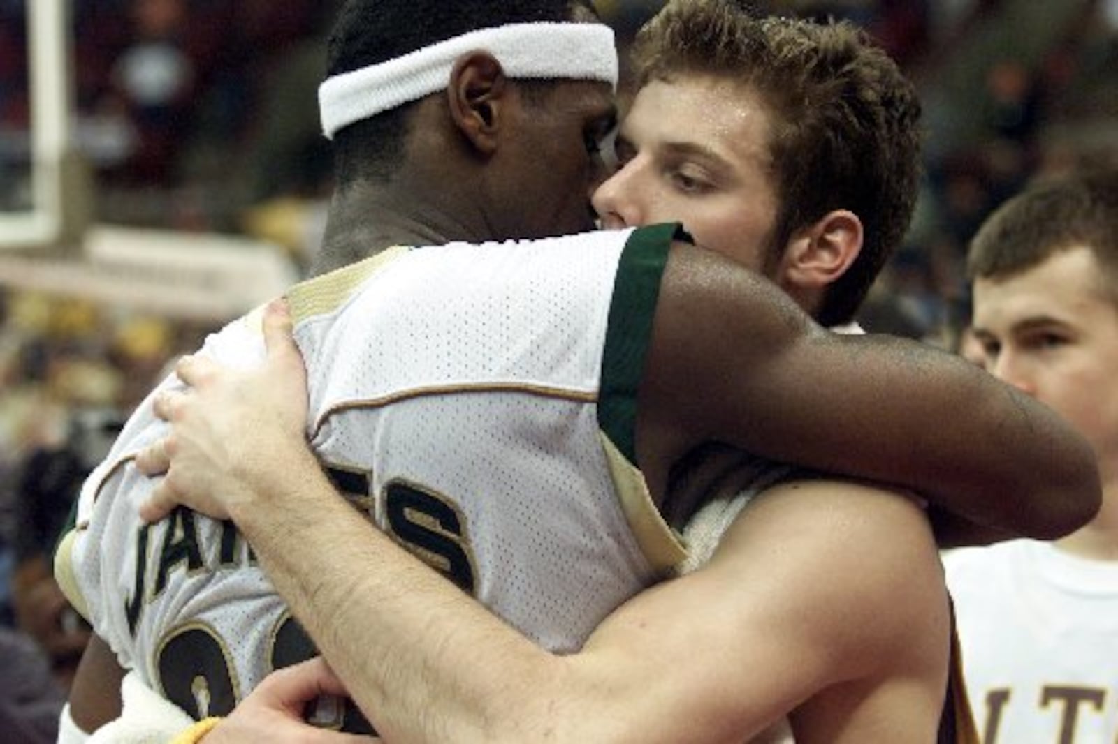 03/22/03 Akron St. V-St. M's LeBron James hugs Alter's Doug Penno after winning the Div. II State Finals on Saturday evening. SHILOW CRAWFORD III