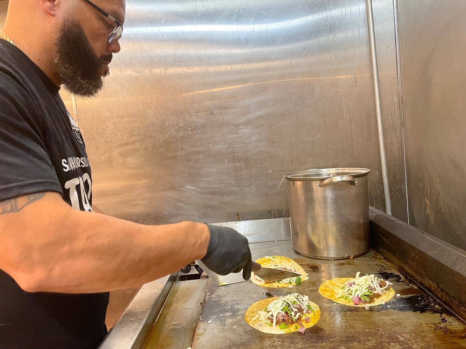 Taco Street Co., located in W. Social Tap & Table, offers beef, chicken, salmon or shrimp birria tacos. Pictured is owner Anthony Thomas. NATALIE JONES/STAFF