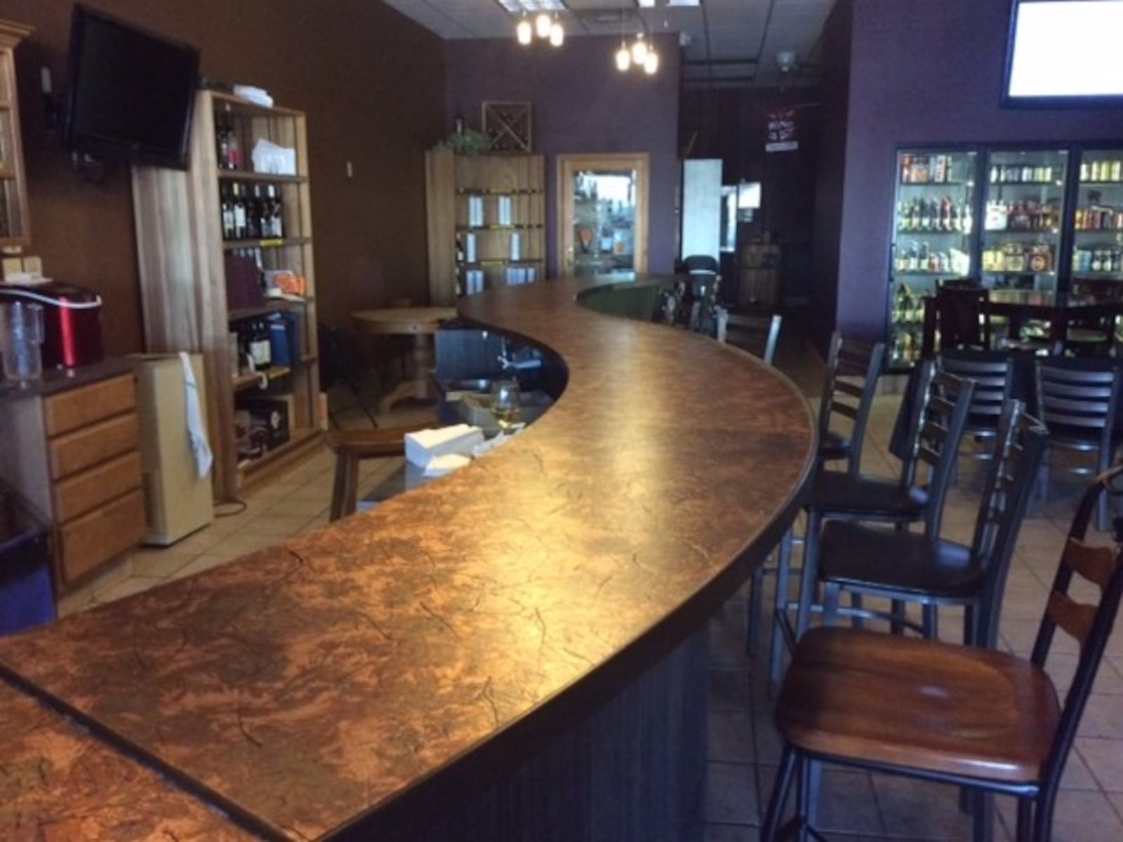 This 26-foot bar was installed less than two months ago at Zemore’s Wine Cellar & Bistro in Bellbrook. MARK FISHER/STAFF