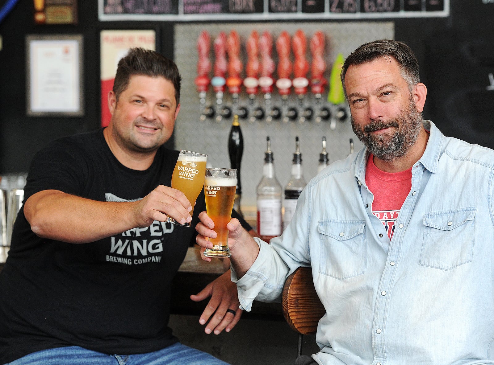 Warped Wing Brewing Company owners, Nick Bowman, left, and John Haggerty at the 26 Wyandot St. location in Dayton.
MARSHALL GORBY\STAFF