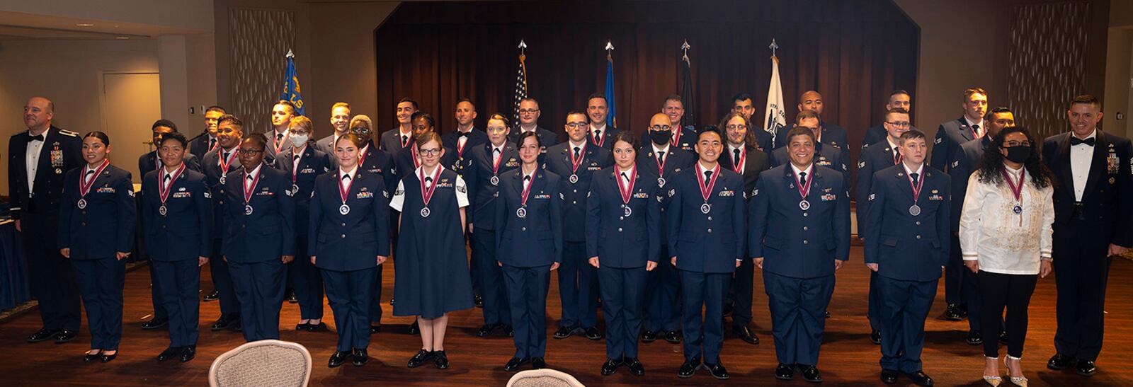 Chief Master Sgt. Grace A. Peterson Airmen Leadership School Class 22-E pose for a photo with Col. Patrick Miller (far left), 88th Air Base Wing and installation commander, and Chief Master Sgt. Jason Shaffer, 88th Air Base Wing command chief, at the end of their graduation ceremony on June 16 at Wright-Patterson Air Force Base. ALS is required for staff sergeant selects and open to eligible civilians as Airmen learn more about leadership and Air Force culture. U.S. AIR FORCE PHOTO/R.J. ORIEZ