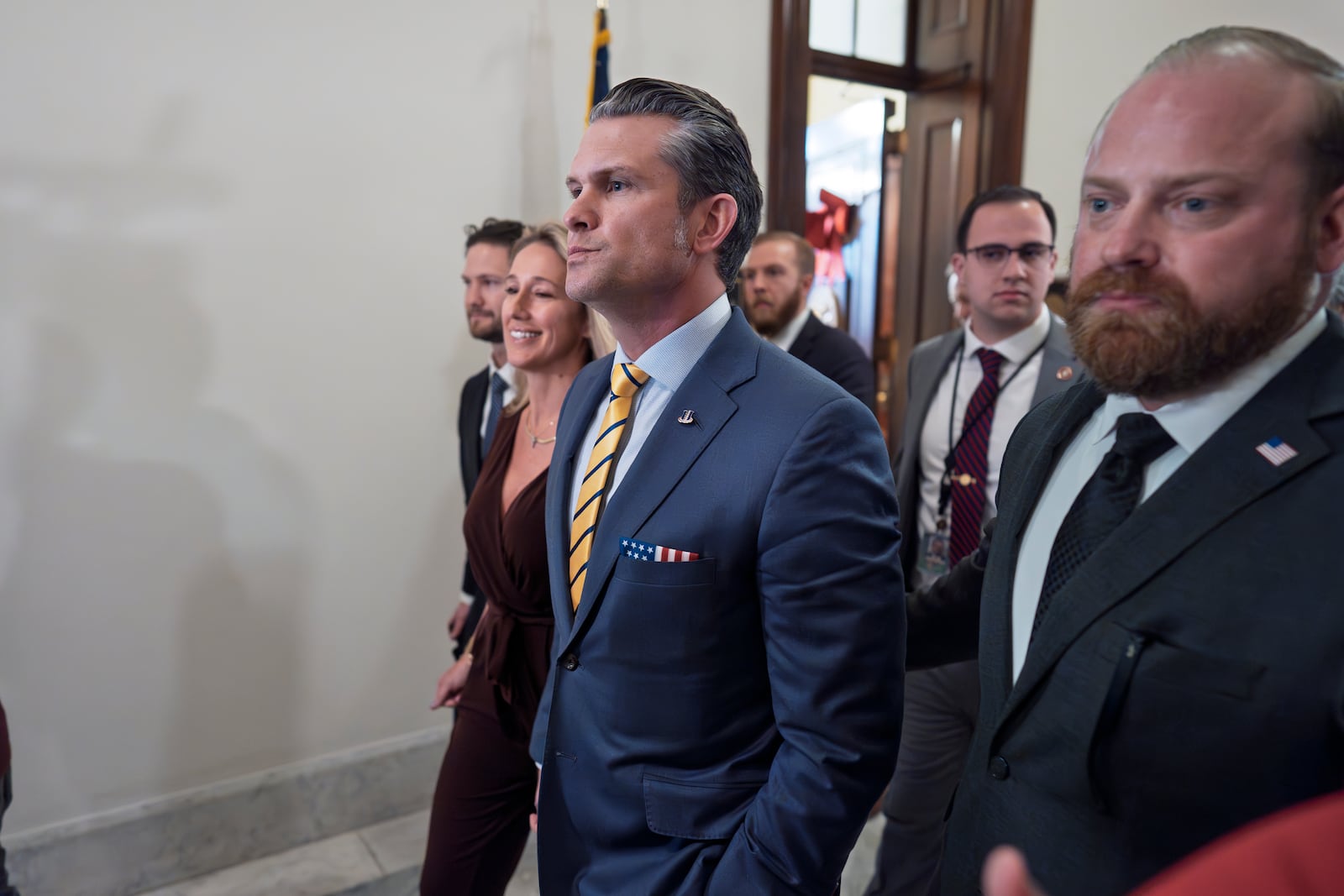 Pete Hegseth, President-elect Donald Trump's nominee to be defense secretary, is joined by his wife Jennifer Rauchet, left, as they arrive to meet with Sen. Ted Budd, R-N.C., a member of the Senate Armed Services Committee, at the Capitol in Washington, Tuesday, Dec. 3, 2024. (AP Photo/J. Scott Applewhite)