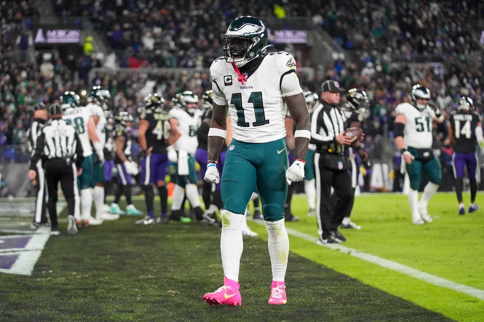 Philadelphia Eagles wide receiver A.J. Brown (11) reacts after teammate quarterback Jalen Hurts scored on a run against the Baltimore Ravens during the first half of an NFL football game, Sunday, Dec. 1, 2024, in Baltimore. (AP Photo/Stephanie Scarbrough)