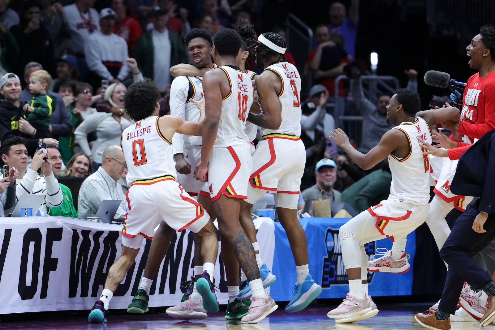 Maryland center Derik Queen, center, reacts with teammates after making the game-winning shot against Colorado State during the second half in the second round of the NCAA college basketball tournament, Sunday, March 23, 2025, in Seattle. (AP Photo/Ryan Sun)