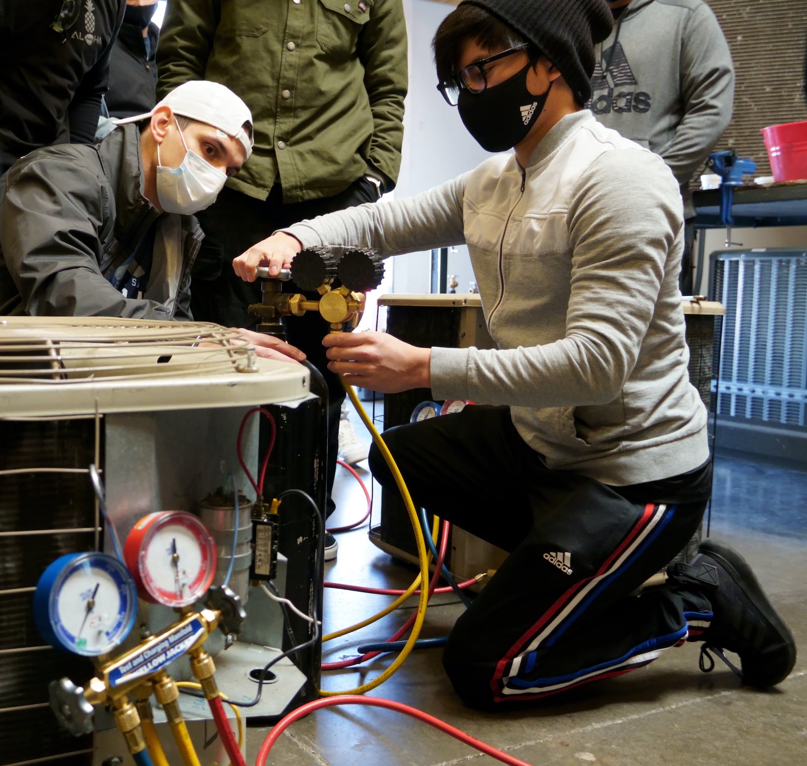 Students at a national trade school work on HVAC training. Business Wire photo