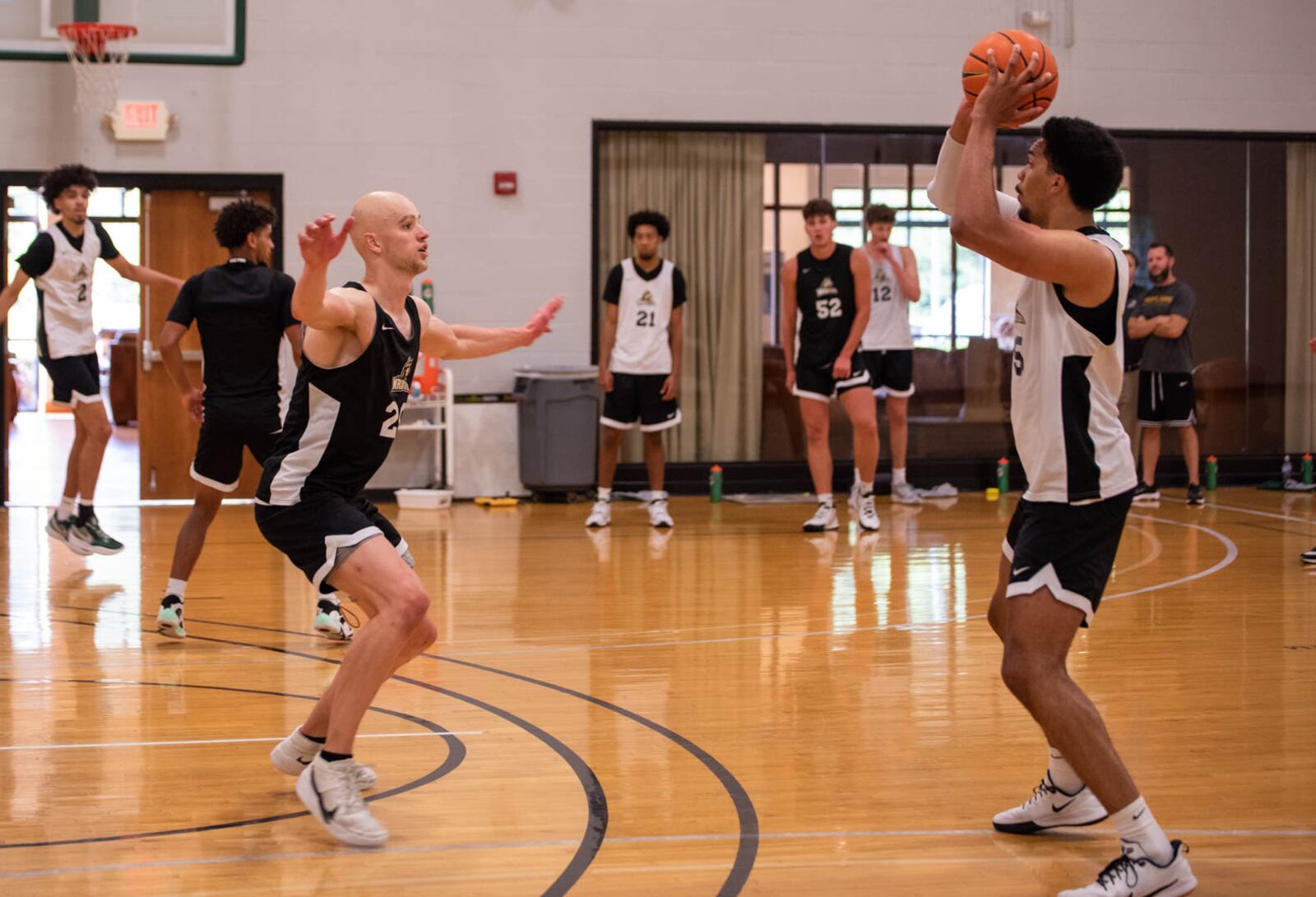 Wright State's Andy Neff (left) defends teammate CJ Wilbourn during a practice session in July. Wright State Athletics photo