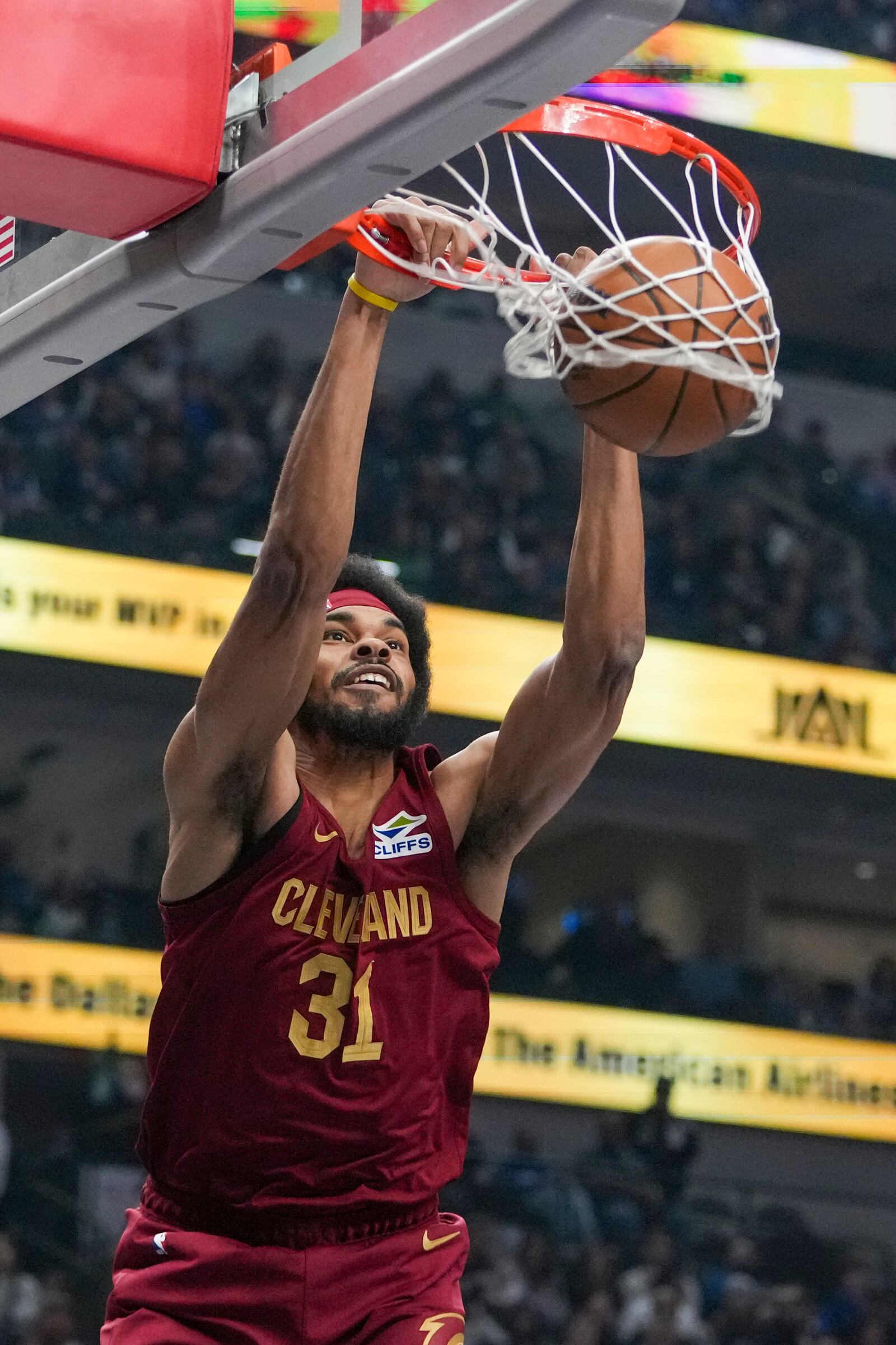 Cleveland Cavaliers center Jarrett Allen dunks on the Dallas Mavericks during the first half of an NBA basketball game, Friday, Jan. 3, 2025, in Dallas. (AP Photo/Julio Cortez)