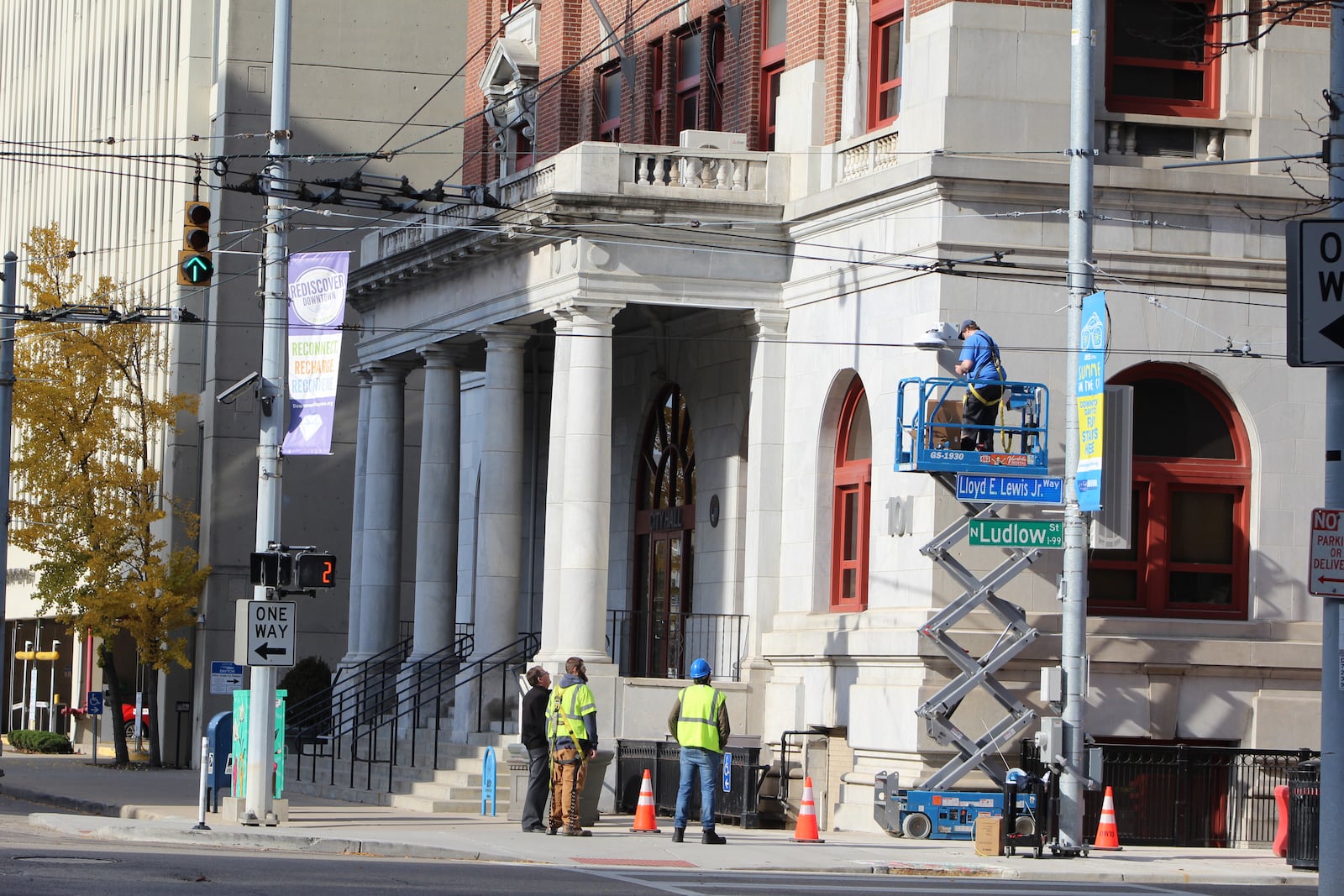 Workers outside of Dayton City Hall in downtown Dayton. CORNELIUS FROLIK / STAFF