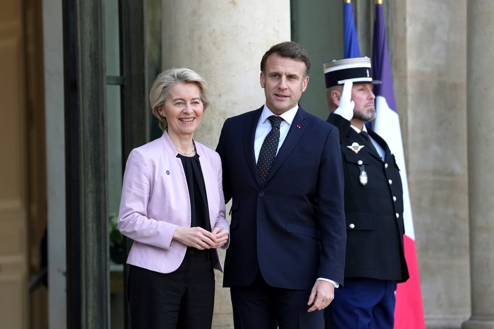 French President Emmanuel Macron, right, welcomes European Commission President Ursula von der Leyen as she arrives for an informal meeting of leaders from key European Union nations and the United Kingdom at the Elysee Palace in Paris, Monday, Feb. 17, 2025. (AP Photo/Aurelien Morissard)