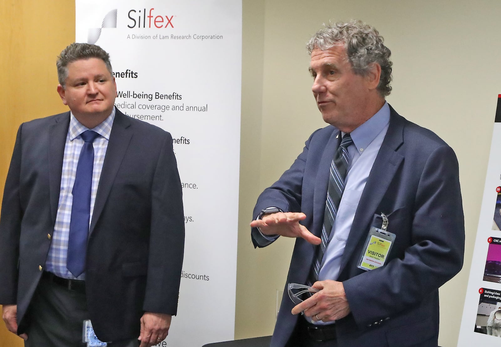 Senator Sherrod Brown speaks to the media about the recently passed CHIPS Act as Silfex, Inc General Manager Rob Skrobak listens Wednesday, Oct. 5, 2022. BILL LACKEY/STAFF