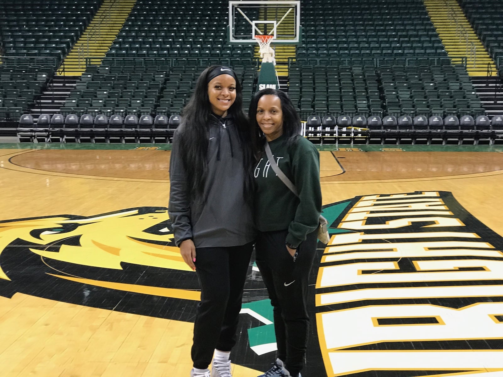 Jada Tate and her mom Jenice on the Nutter Center court after Wright State’s exhibition victory over Tiffin last week. Tom Archdeacon/CONTRIBUTED