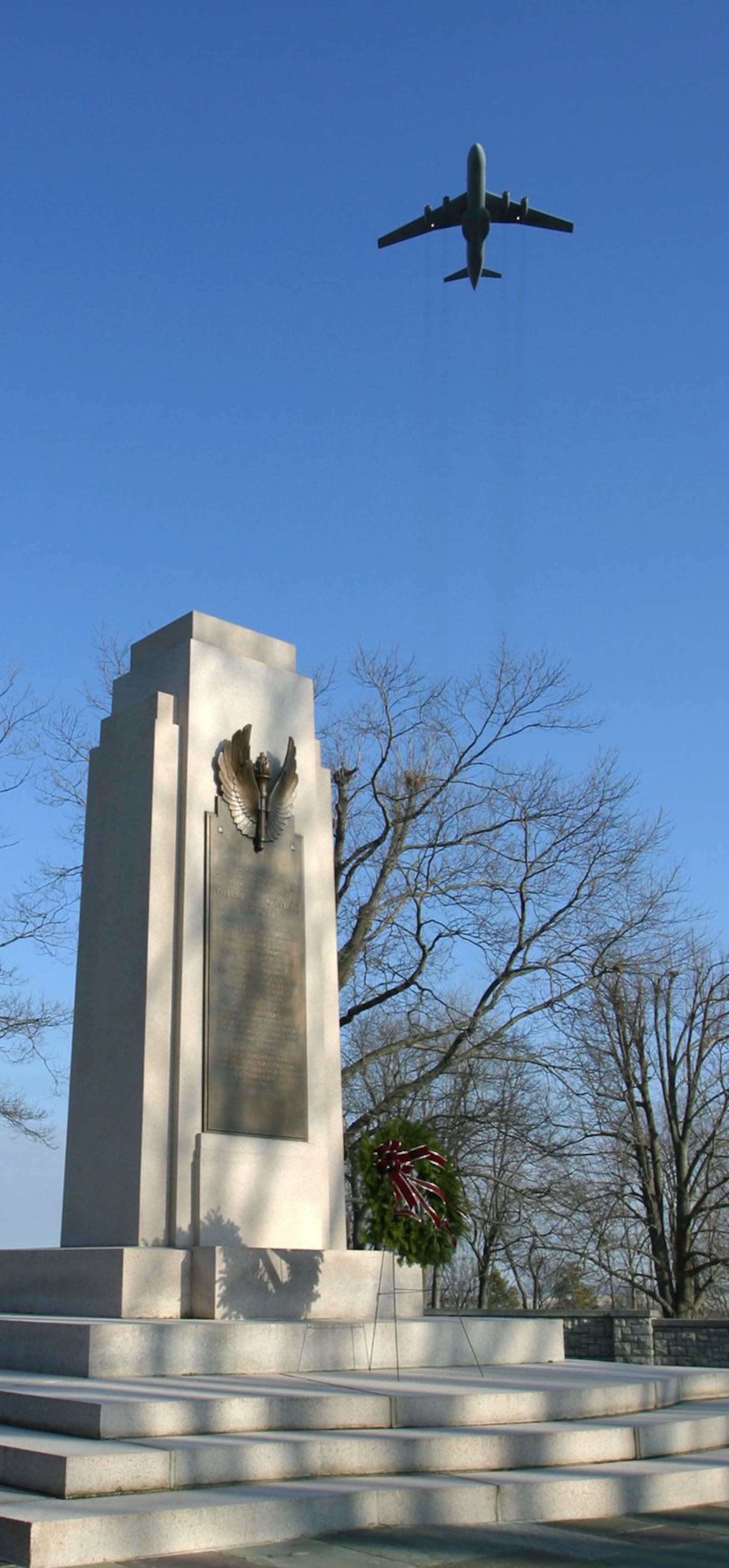 The C-141 Starlifter from the 445th Airlift Wing at Wright-Patterson Air Force Base flies over Wright Memorial Hill as part of a past commemoration of the anniversary of powered flight. TY GREENLEES/STAFF