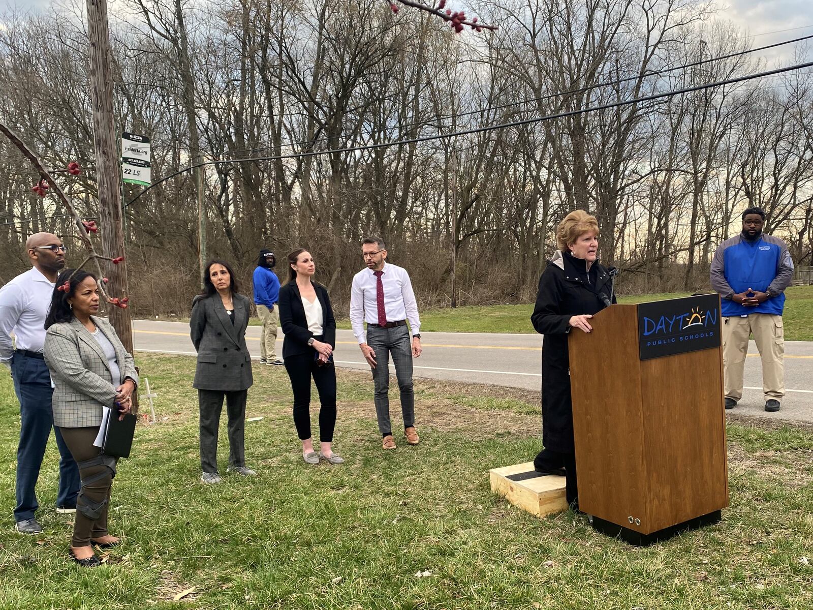 Elizabeth Lolli, superintendent of Dayton Public Schools, speaks to media on Monday, March 6 outside of Dunbar High School. Left to right, back row, are David Lawrence, DPS business manager; Hiwot Abraha, Chief Financial Officer; Gabriella Pickett, DPS board member; Jocelyn Rhynard, DPS board member, and Joe Lacey, DPS board member. Eileen McClory / Staff