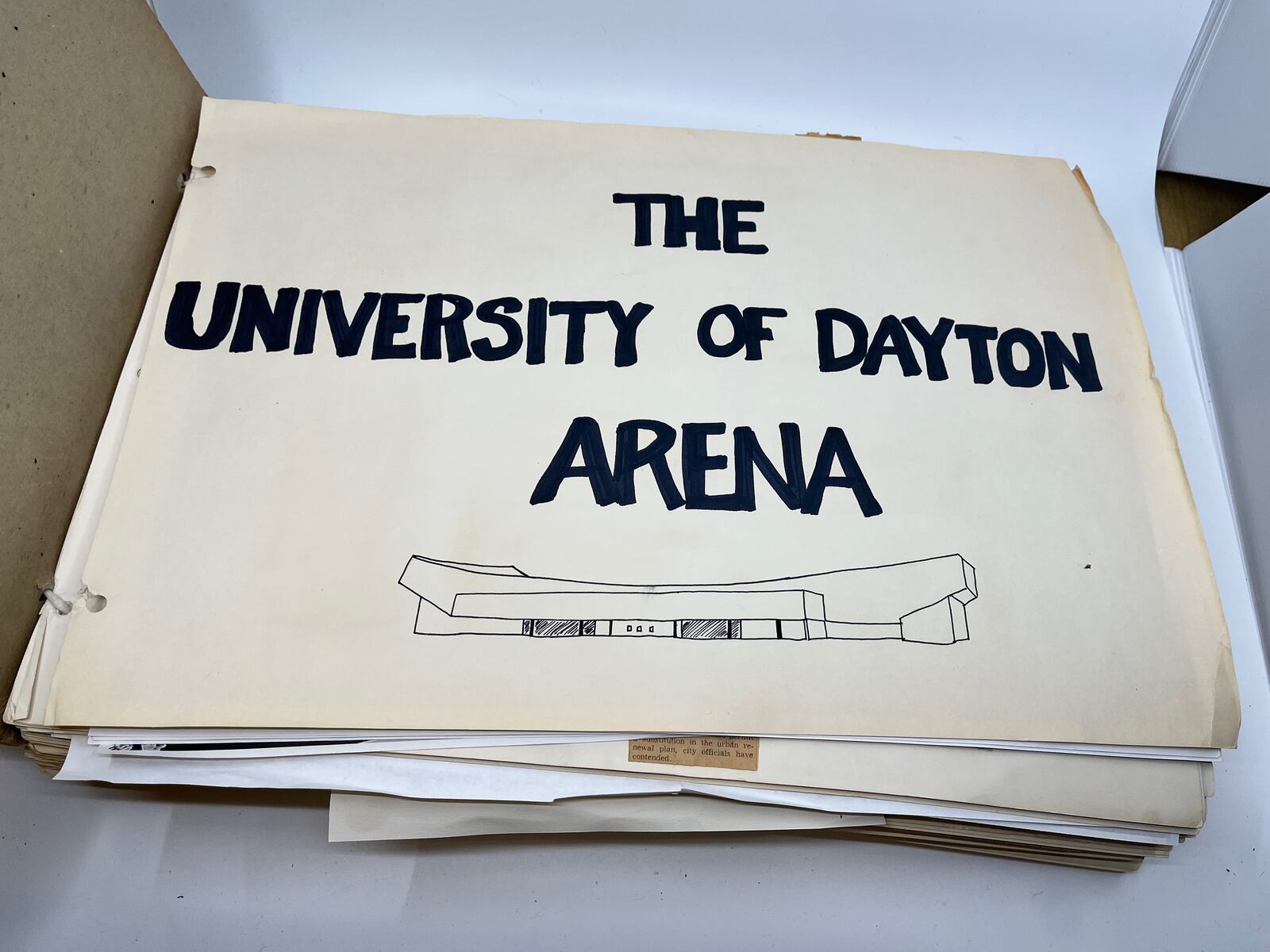 The scrapbook kept by Tom Frericks, the man most responsible for getting UD Arena built, includes newspaper clips, photos and other material related to the construction of the arena. Photo by David Jablonski