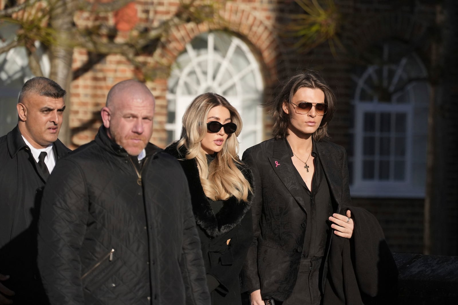 Damian Hurley, right, and Kate Cassidy, second right, arrives the funeral service of One Direction singer Liam Payne at St Mary's Church in Amersham, England, Wednesday, Nov. 20, 2024. (Andrew Matthews/PA via AP)