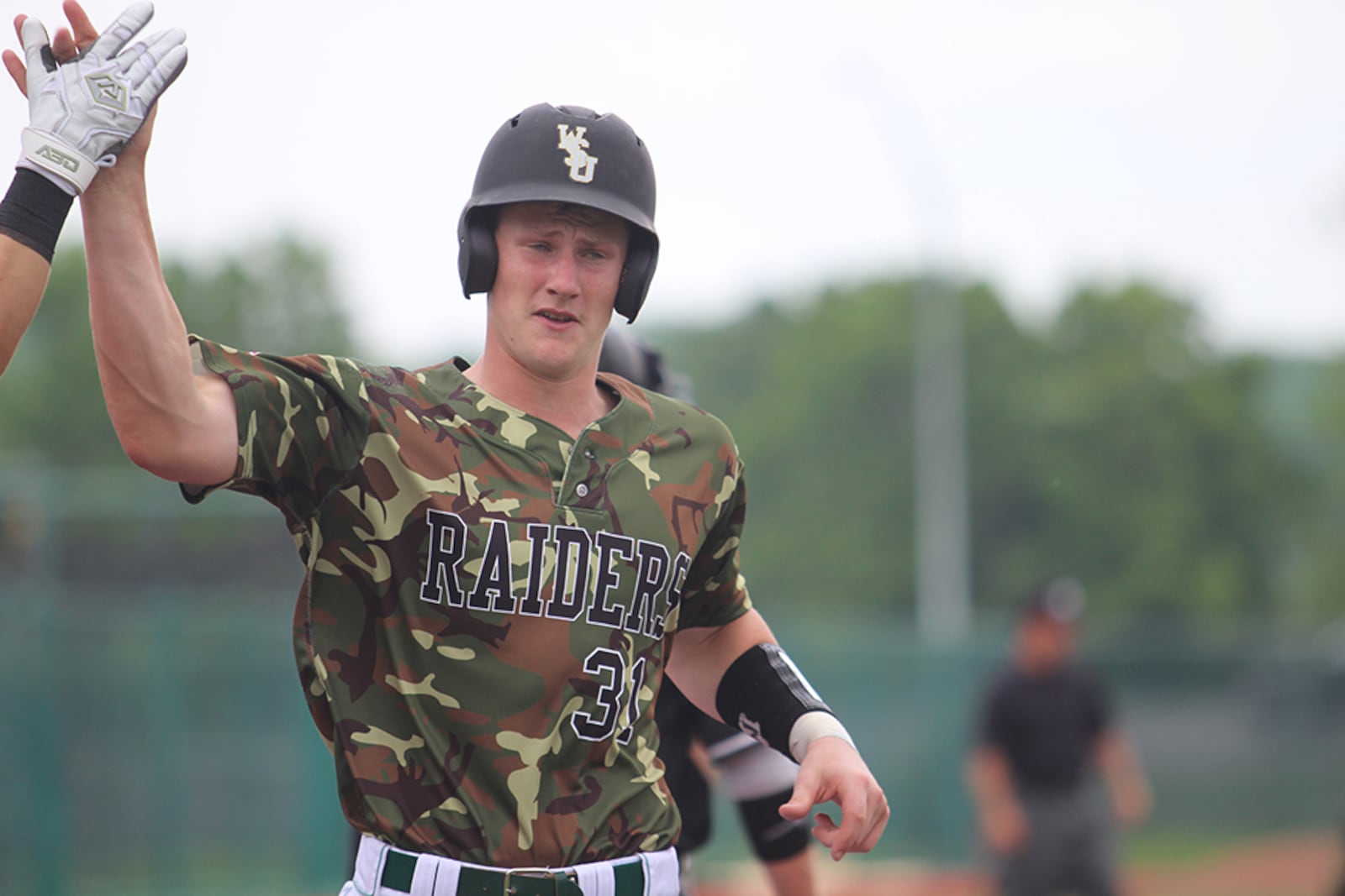 Raiders catcher Sean Murphy scores from second base in Saturday’s Horizon League victory over Valpo. Wright State earned a second straight trip to the NCAA tournament. Mike Hartsock/WHIO-TV