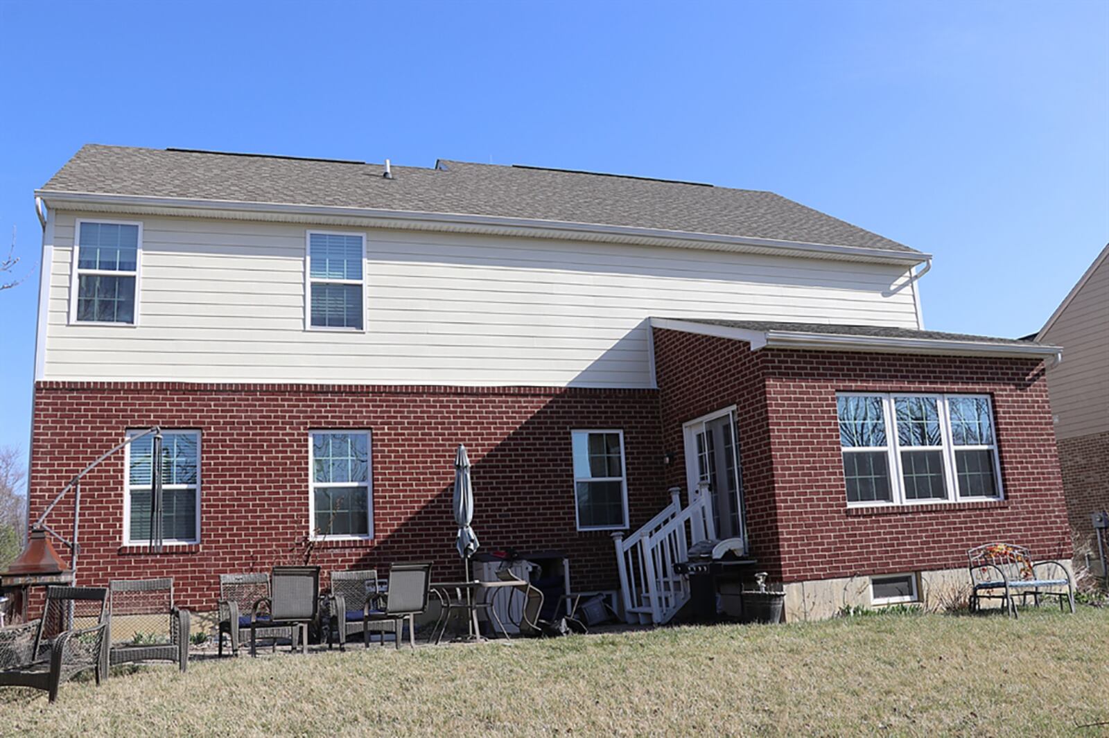 Patio doors from the morning room lead out to a paver patio and the back yard. CONTRIBUTED PHOTO BY KATHY TYLER