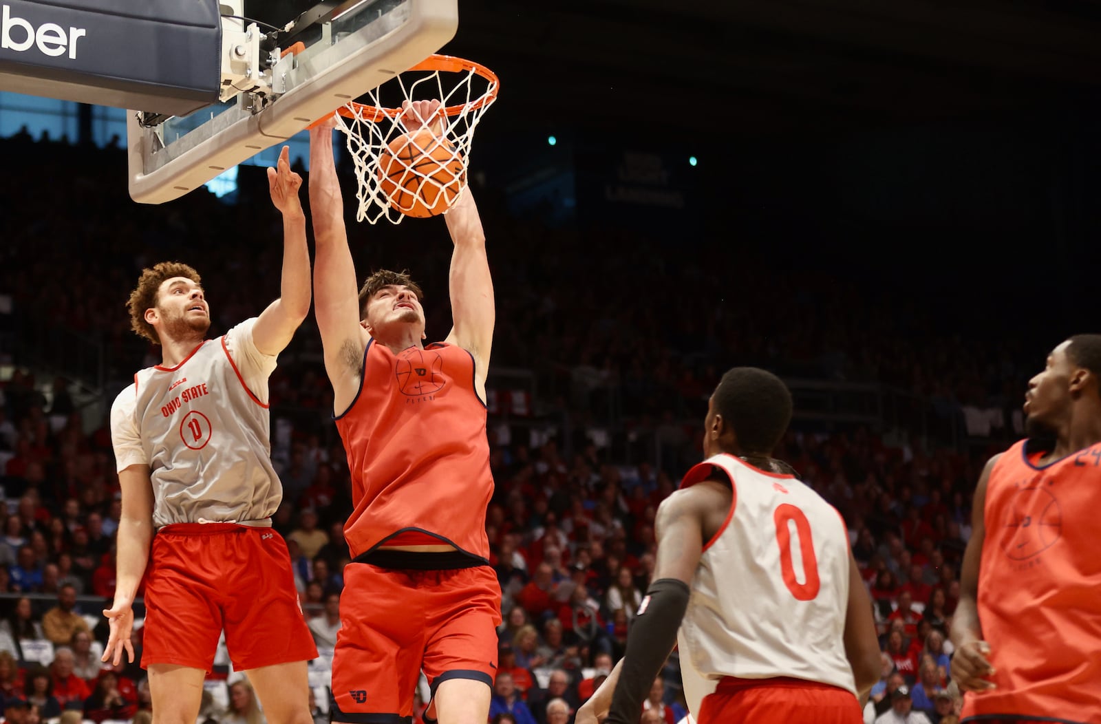 Dayton's Isaac Jack dunks against Ohio State in an exhibition game on Sunday, Oct. 22, 2023, at UD Arena. David Jablonski/Staff