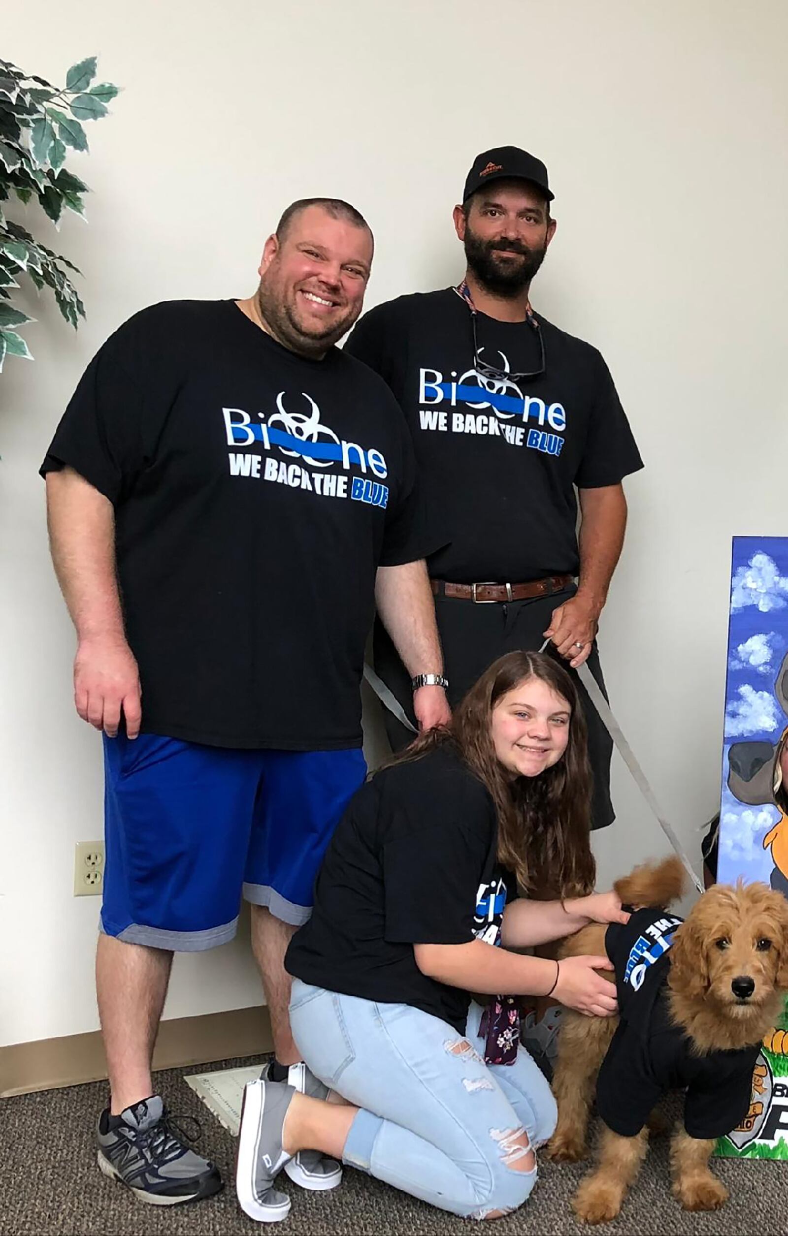 Jonathan Schaffer (left) owns Bio-One Dayton with his wife Samantha. They started the business out of their home, but today have an office location in south Dayton. He is shown with his two full-time employees, Andrew Grant and Kaitlyn Check and the office mascot, Golden doodle, "Bio-One Boone." CONTRIBUTED