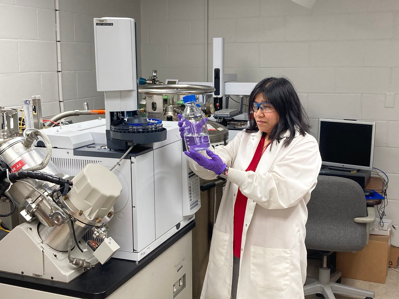 University of Dayton chemical engineer Jhoanna Alger examines aviation fuel in the lab. UD photo