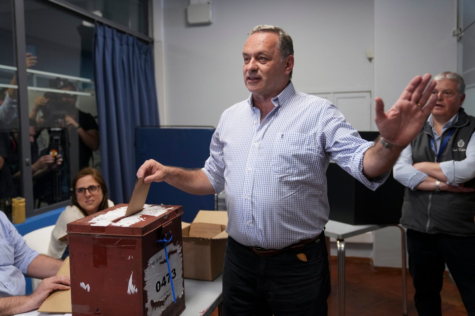 Alvaro Delgado, candidate for the ruling National Party, votes in the presidential run-off election in Montevideo, Uruguay, Sunday, Nov. 24, 2024. (AP Photo/Natacha Pisarenko)