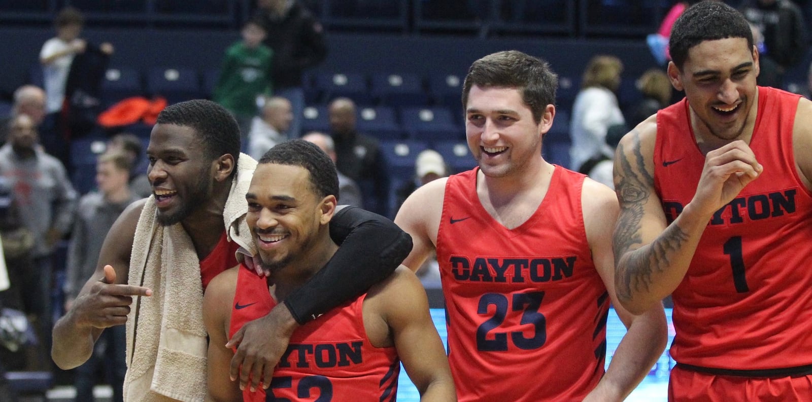 Dayton’s Jalen Crutcher, Camron Greer, Jack Westerfield and Obi Toppin leave the court after a victory against Rhode Island on Saturday, Feb. 9, 2019, at the Ryan Center in Kingston, R.I. David Jablonski/Staff